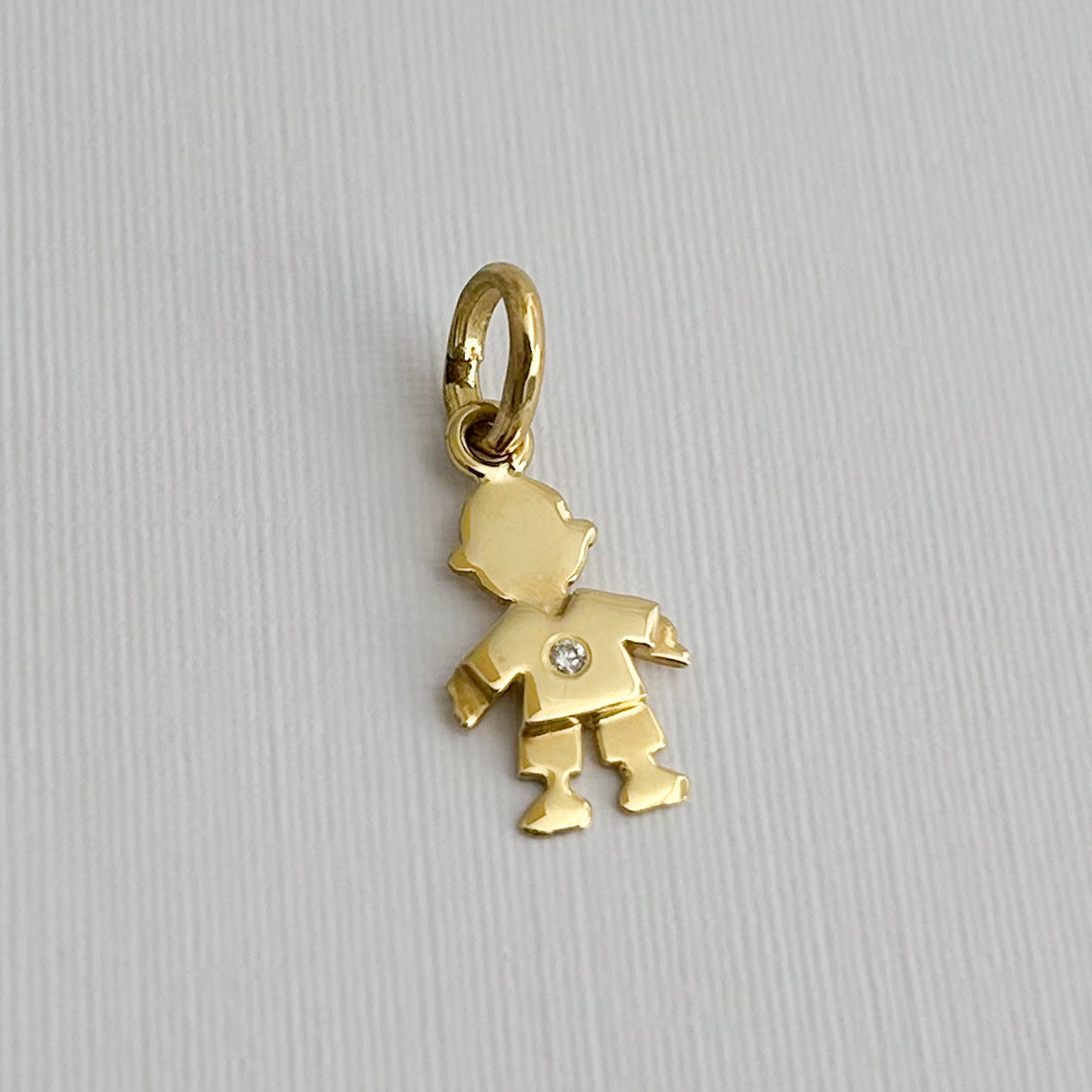 Dije Niño/a con diamante Oro18k