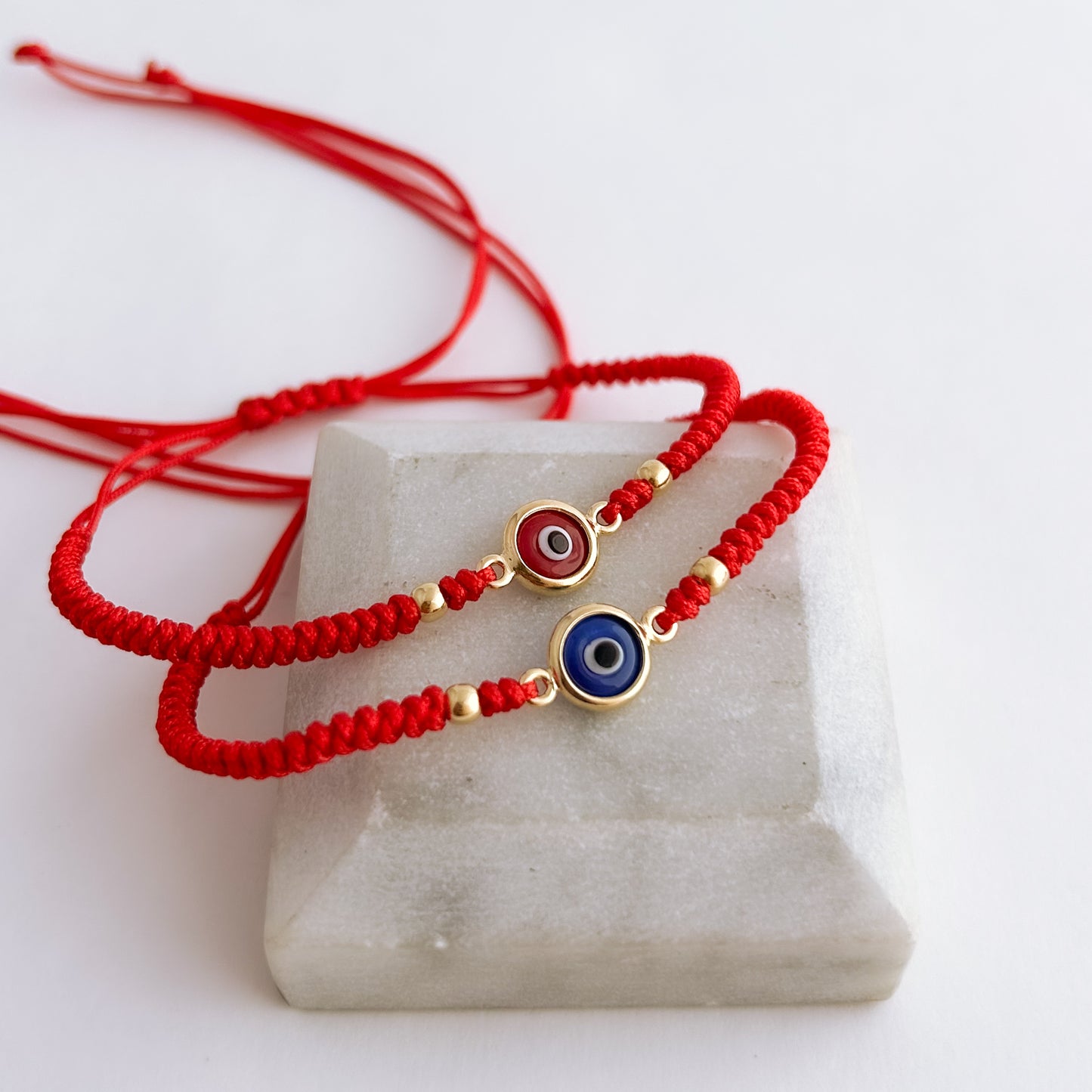 Pulsera tejida Ojo Turco Bicelado con 2 bolitas en Oro18k