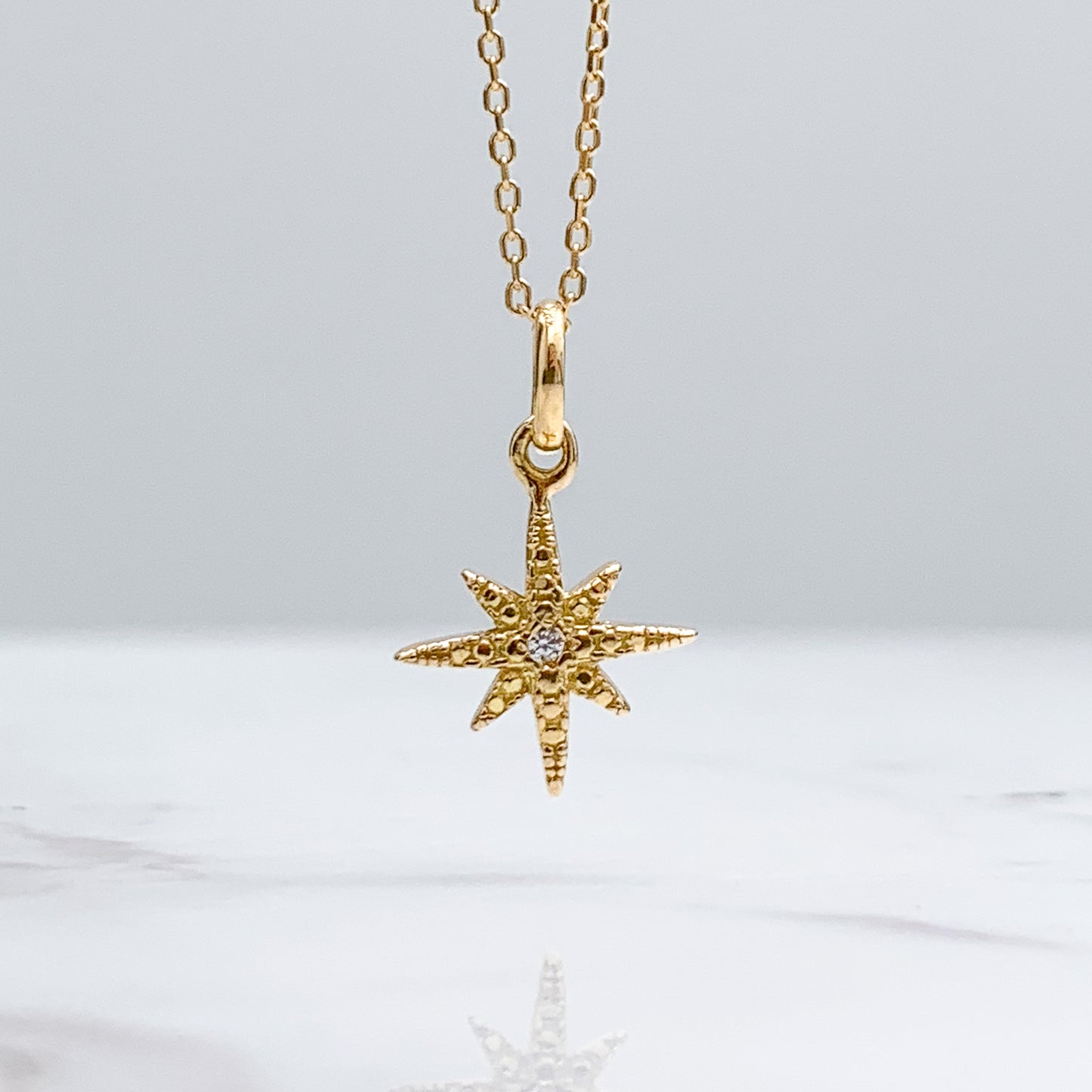 Dije de estrella fugaz oro 18k