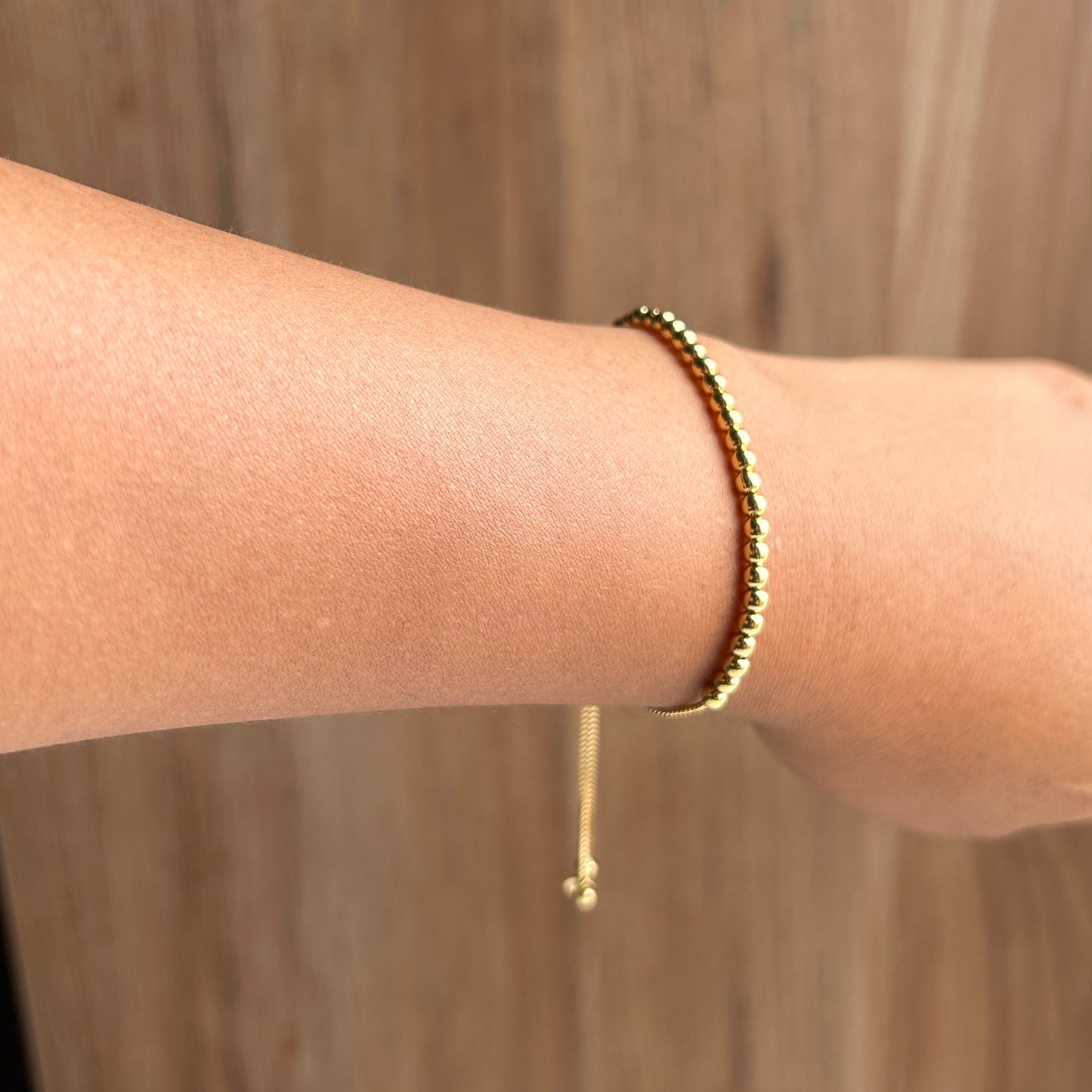Pulsera bolitas regulable oro 18k
