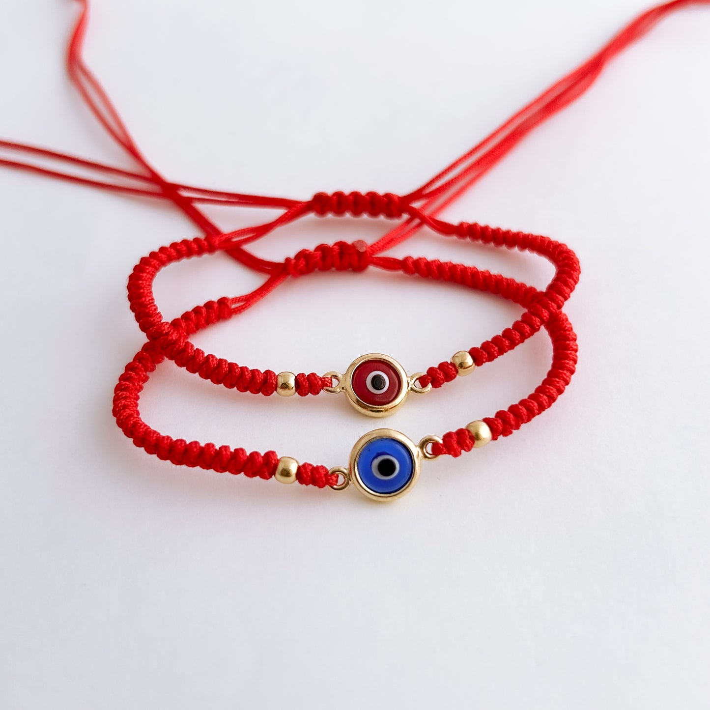 Pulsera tejida Ojo Turco Bicelado con 2 bolitas en Oro18k