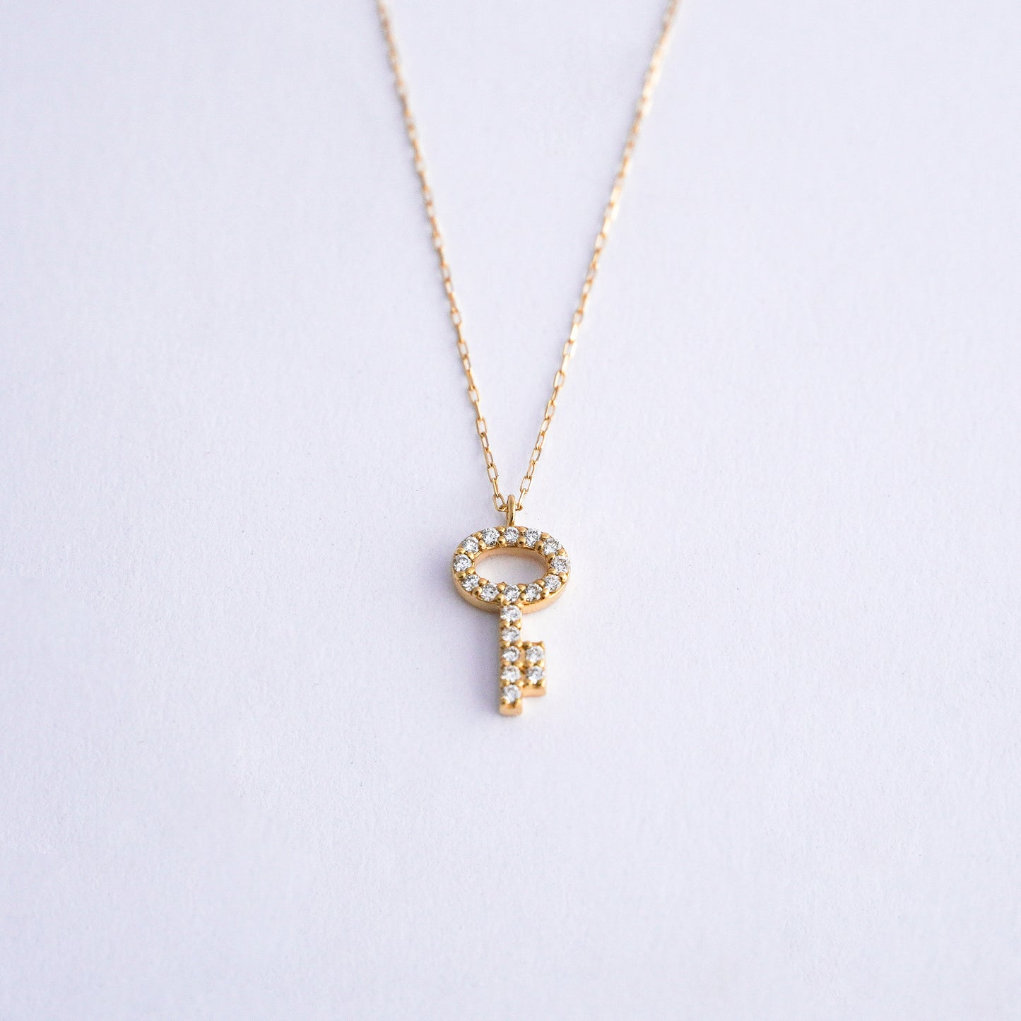 Collar llave con diamantes naturales en Oro18k