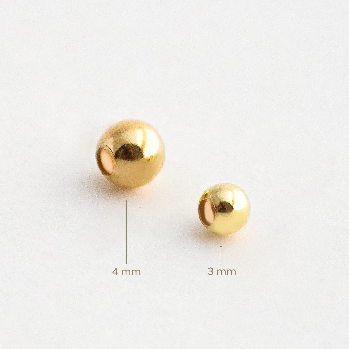 Bolita Pasante Lisa en Oro 18K