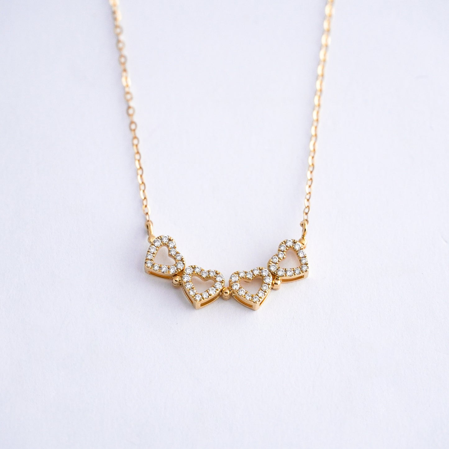 Collar corazones trebol con diamantes naturales en Oro18k