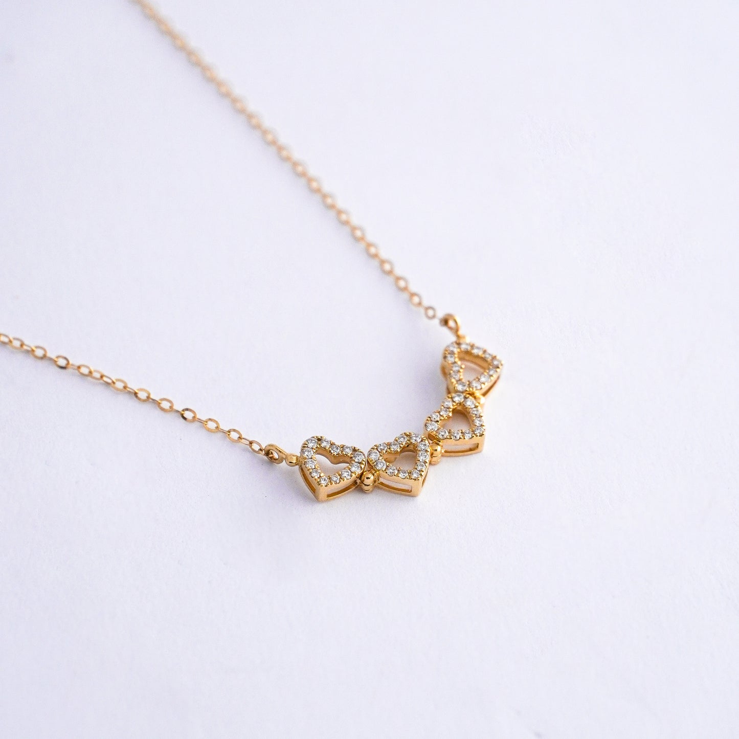 Collar corazones trebol con diamantes naturales en Oro18k
