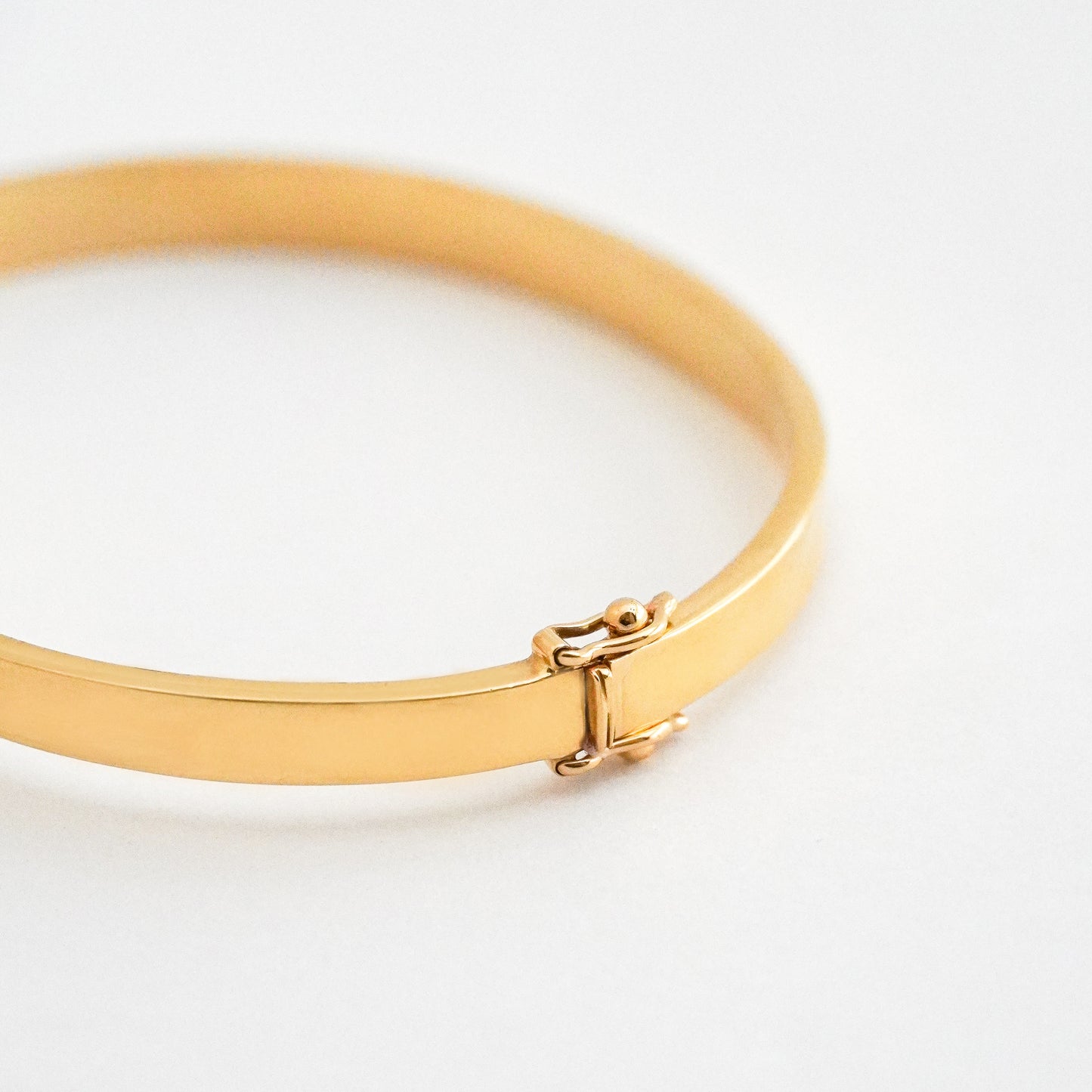 Puñera cinta gruesa 5mm Oro18k