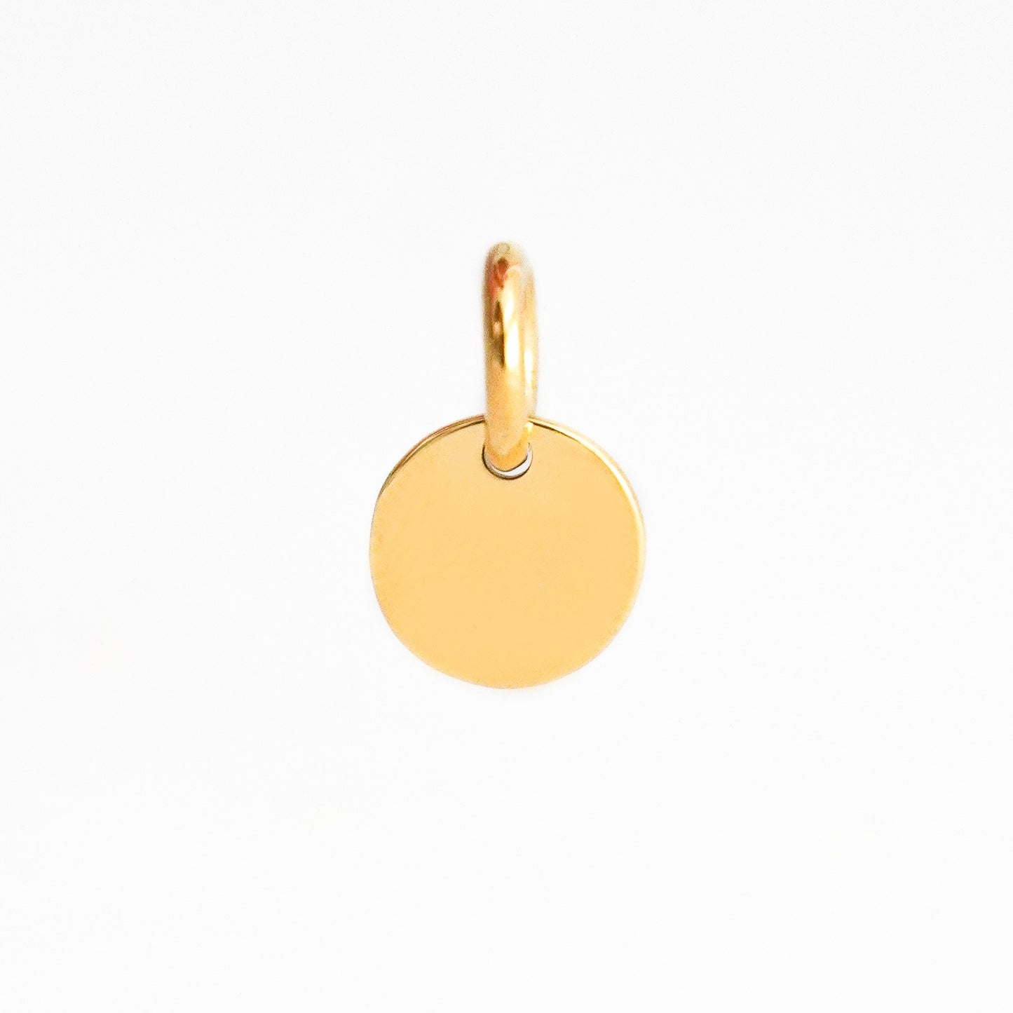 Dije Placa redonda Mini 7 mm Oro 18K