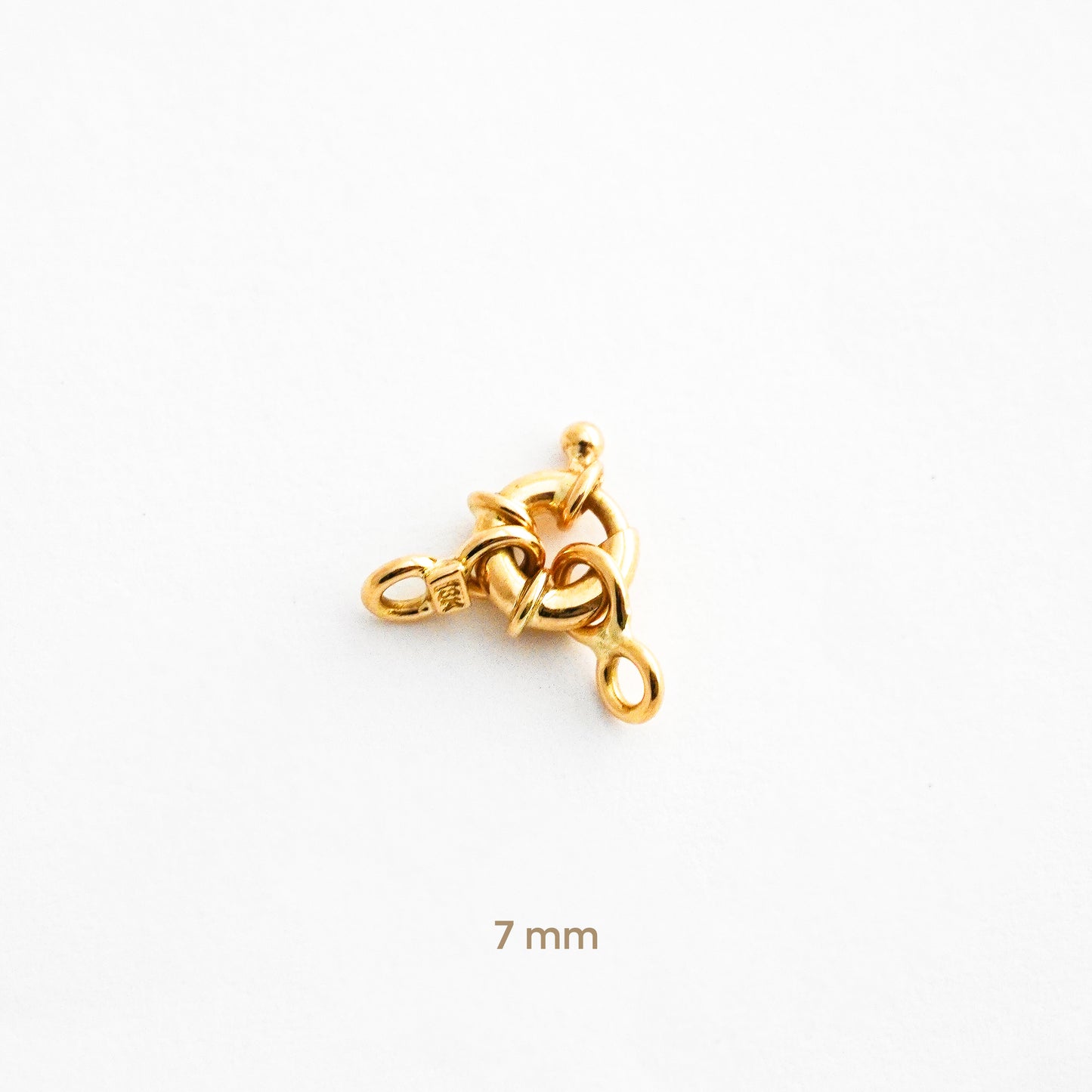 Broche mosquetón o timón en Oro 18K