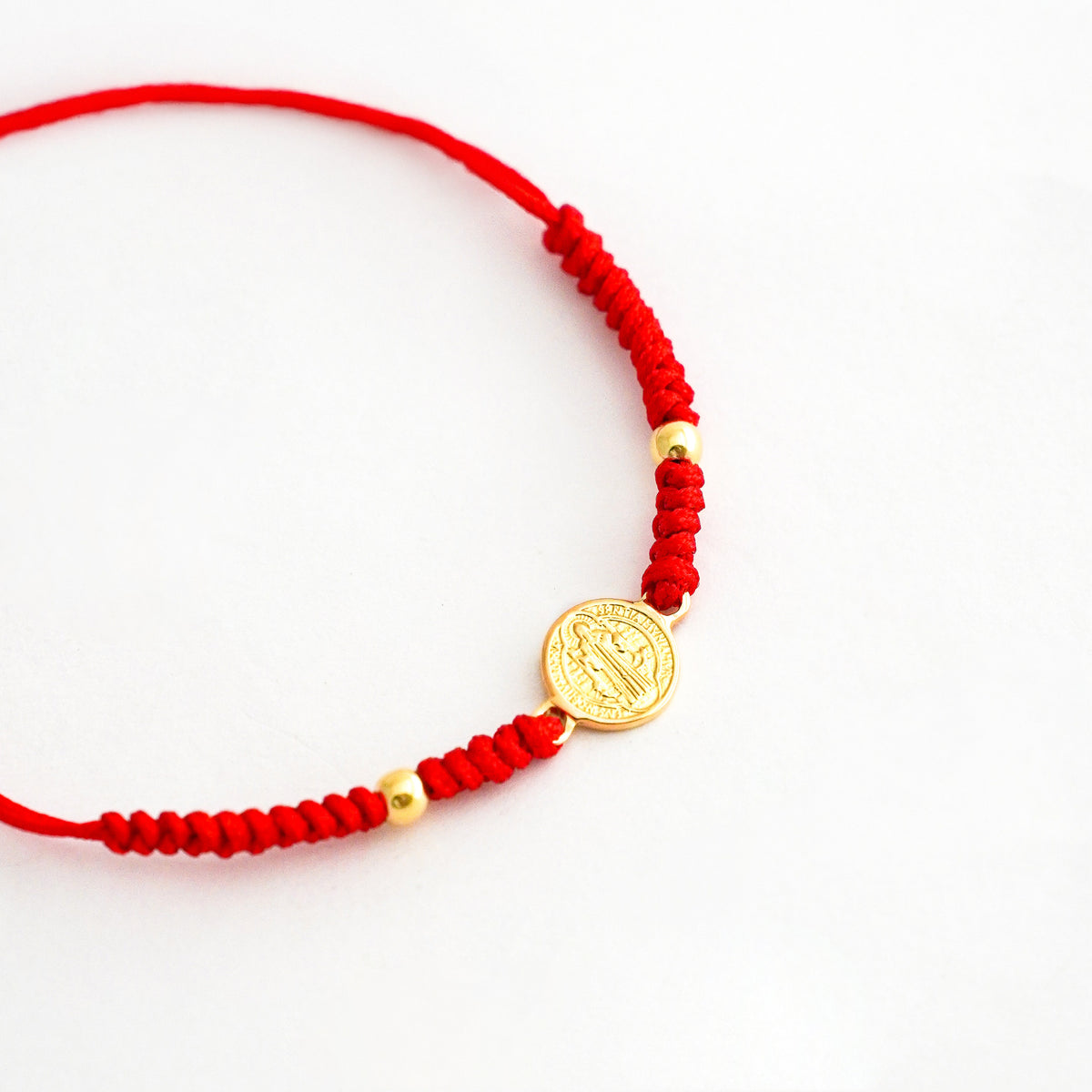 Pulsera Tejida San Benito con 2 bolitas en Oro 18k
