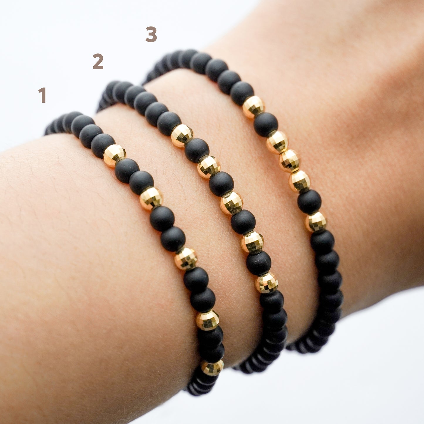 Pulsera tejida ónix con bolitas diamantadas 4 mm en Oro18k