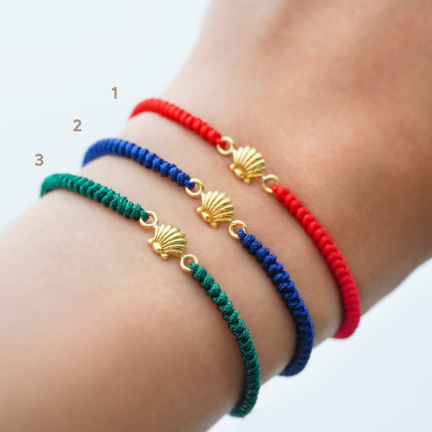 Pulsera tejida conchita de mar en Oro18k