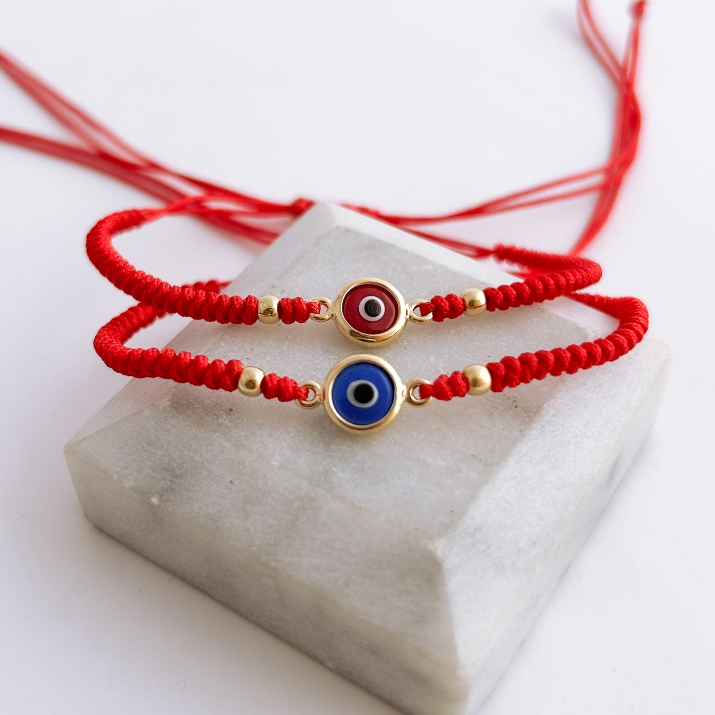 Pulsera tejida Ojo Turco Bicelado con 2 bolitas en Oro18k
