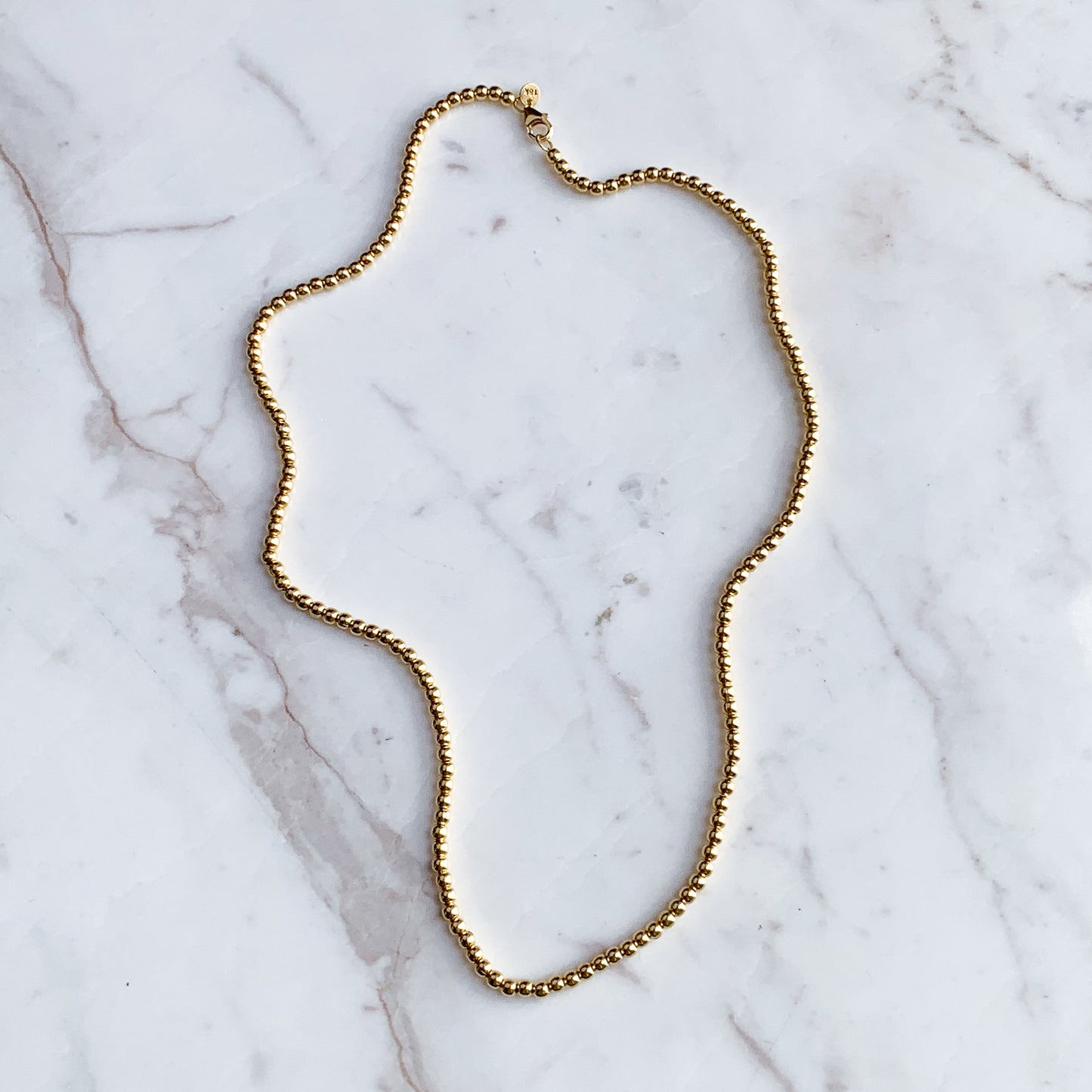 Cadena Bolitas 3 mm en oro 18k