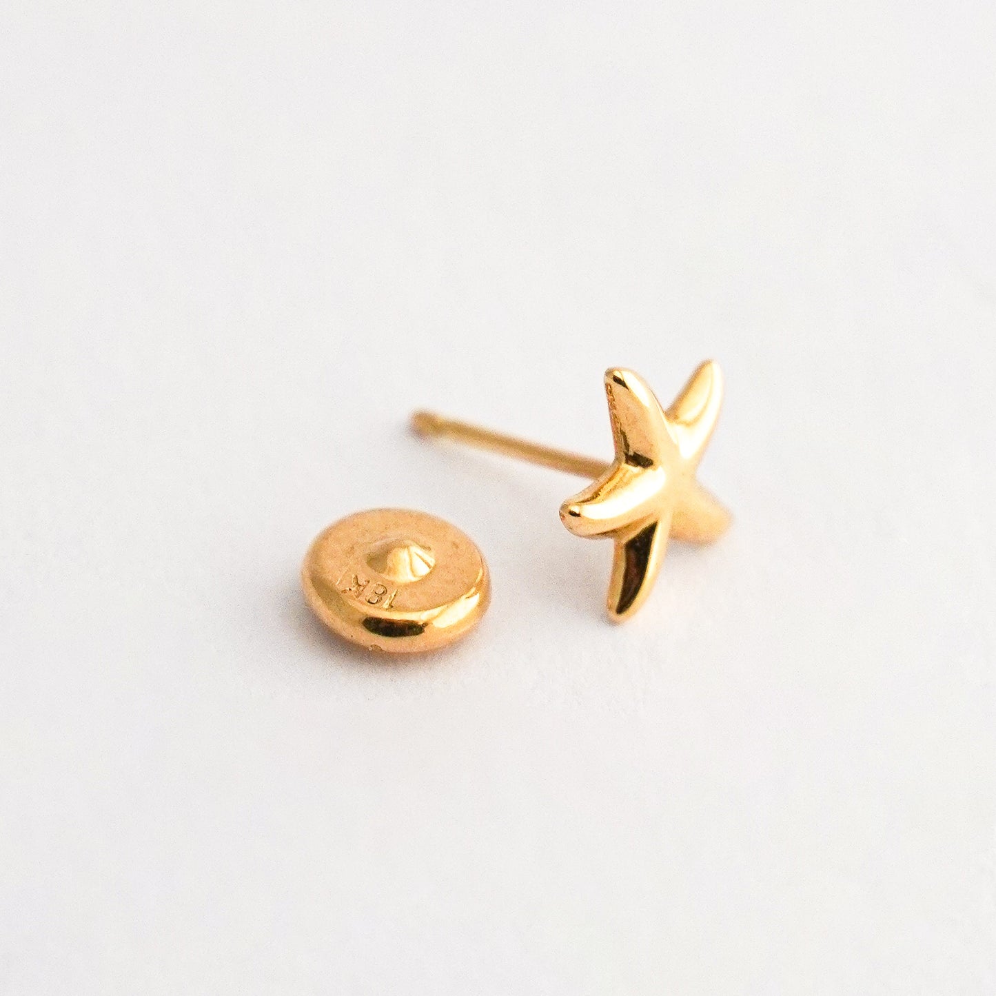 1/2 par arete bebé Estrella de Mar Oro 18k