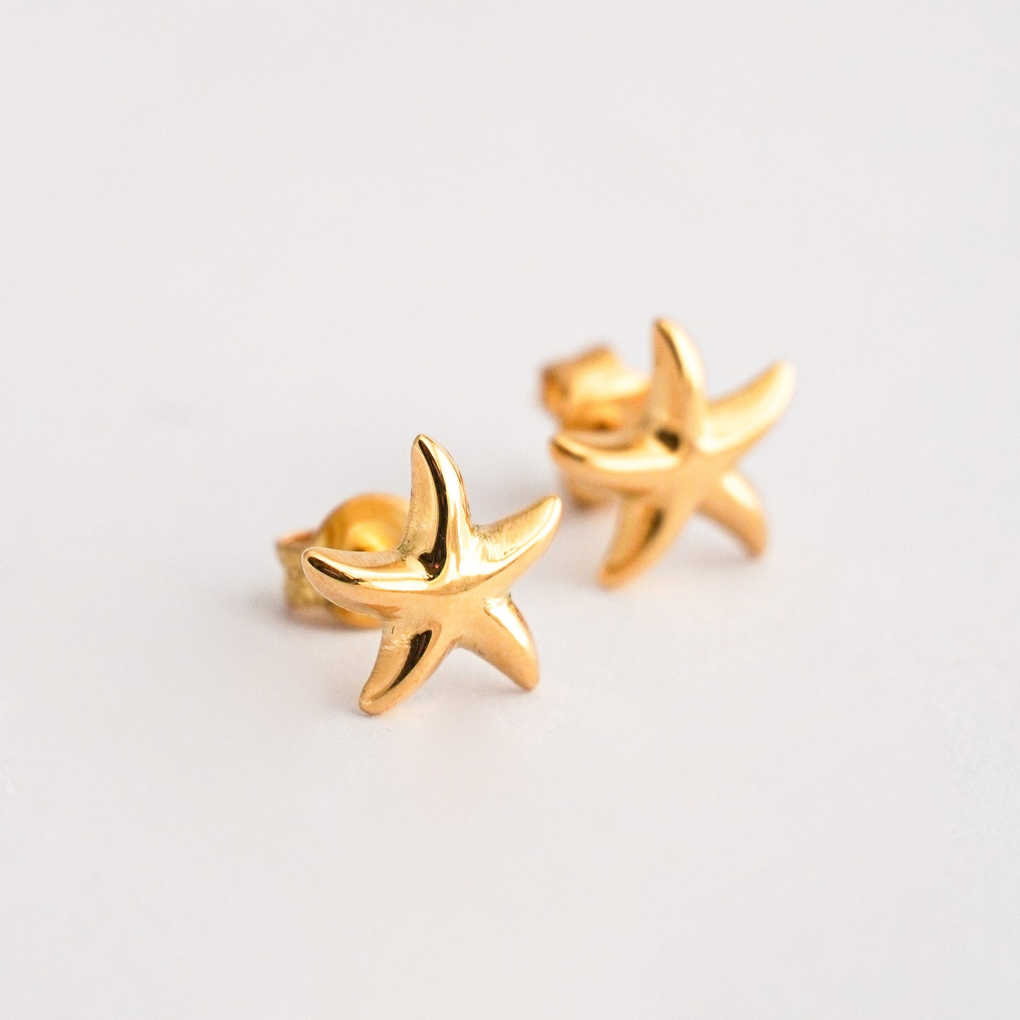 Aretes Estrella de Mar en oro 18k