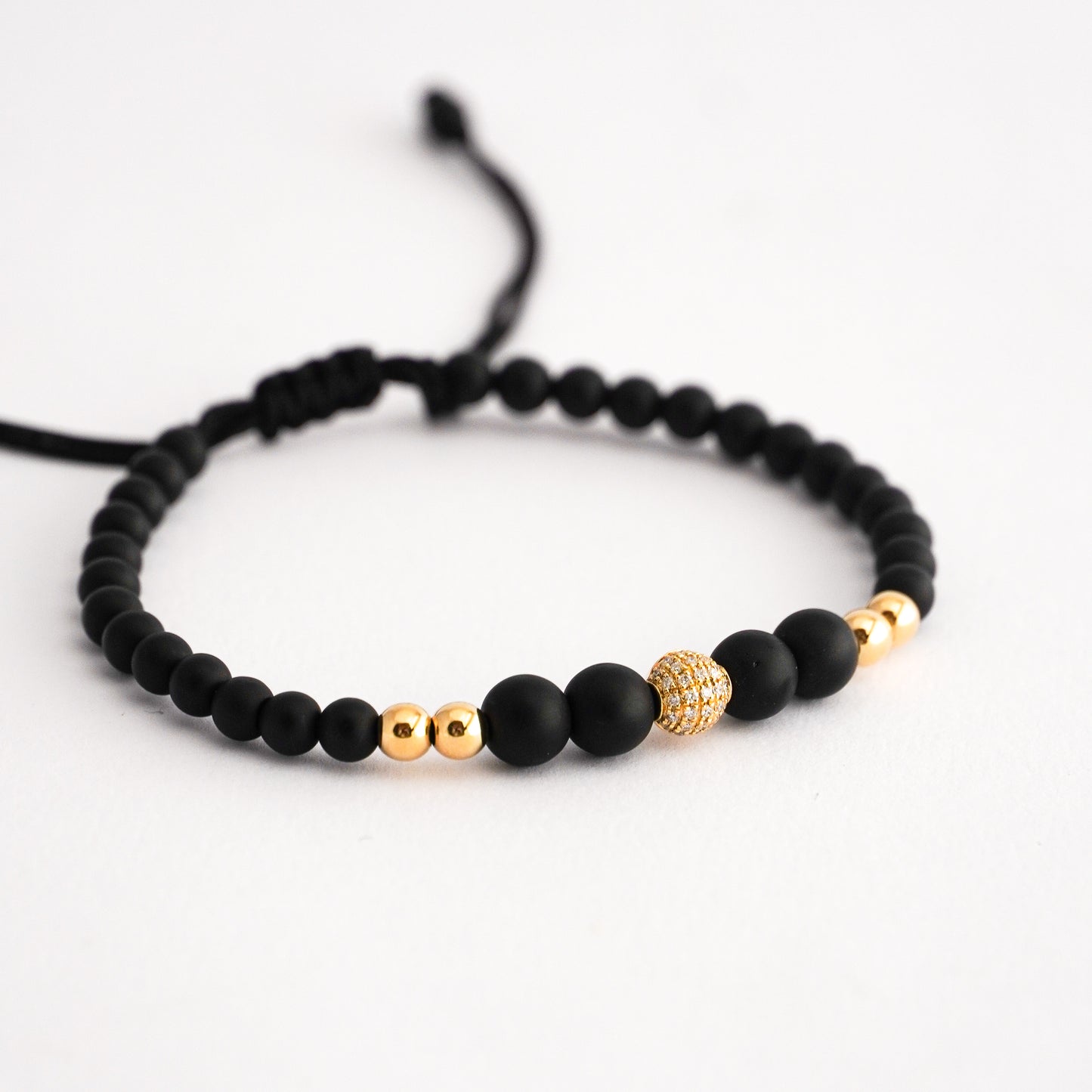 Pulsera ónix esfera con diamantes en Oro18k