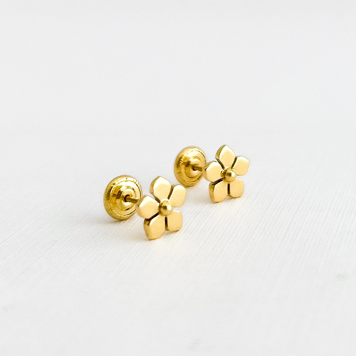 Aretes flor violeta oro 18k