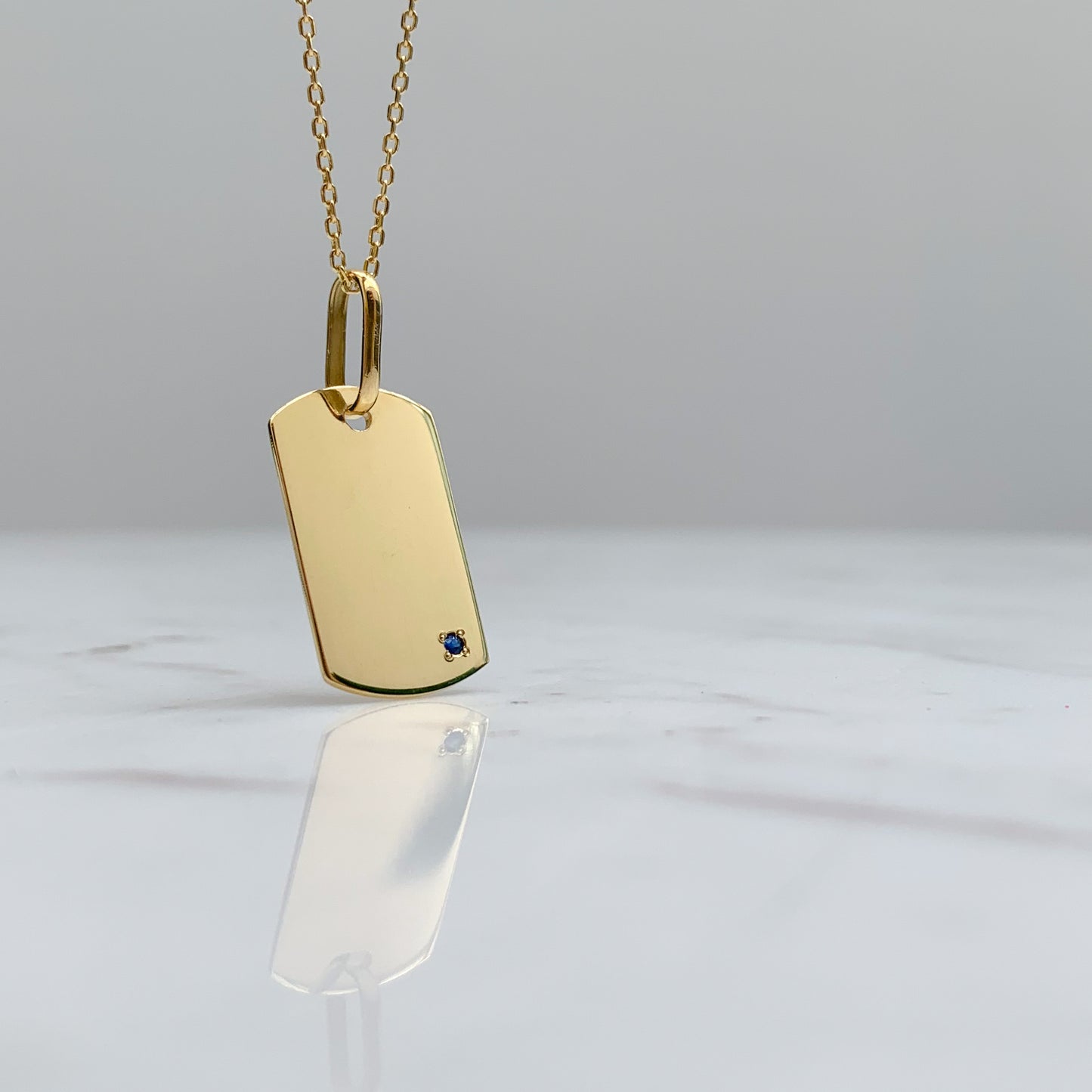 Dije placa militar con zafiro en Oro18k