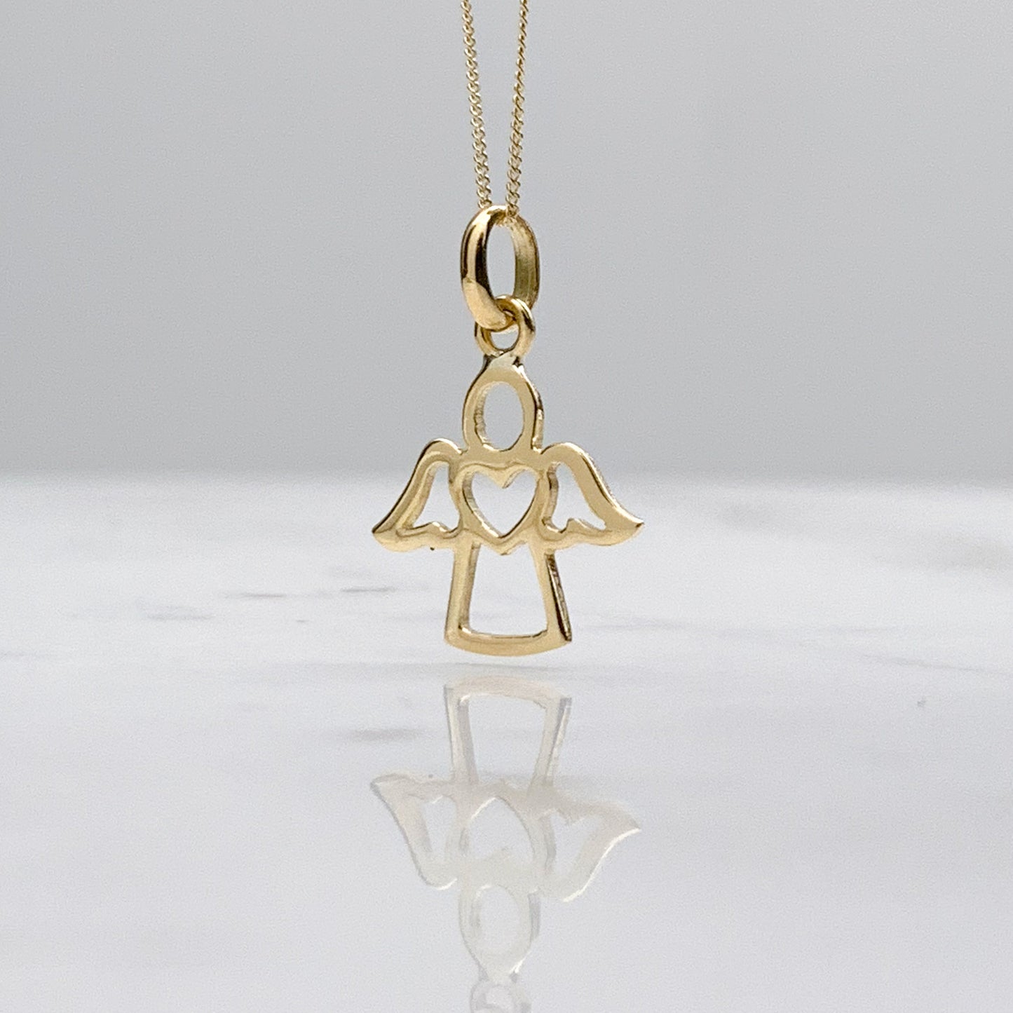 Dije de Angelito corazón Oro18k