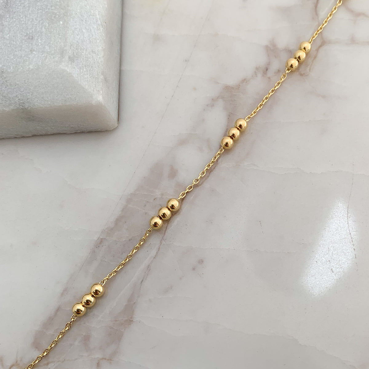 Pulsera Tres Bolitas en Oro 18K