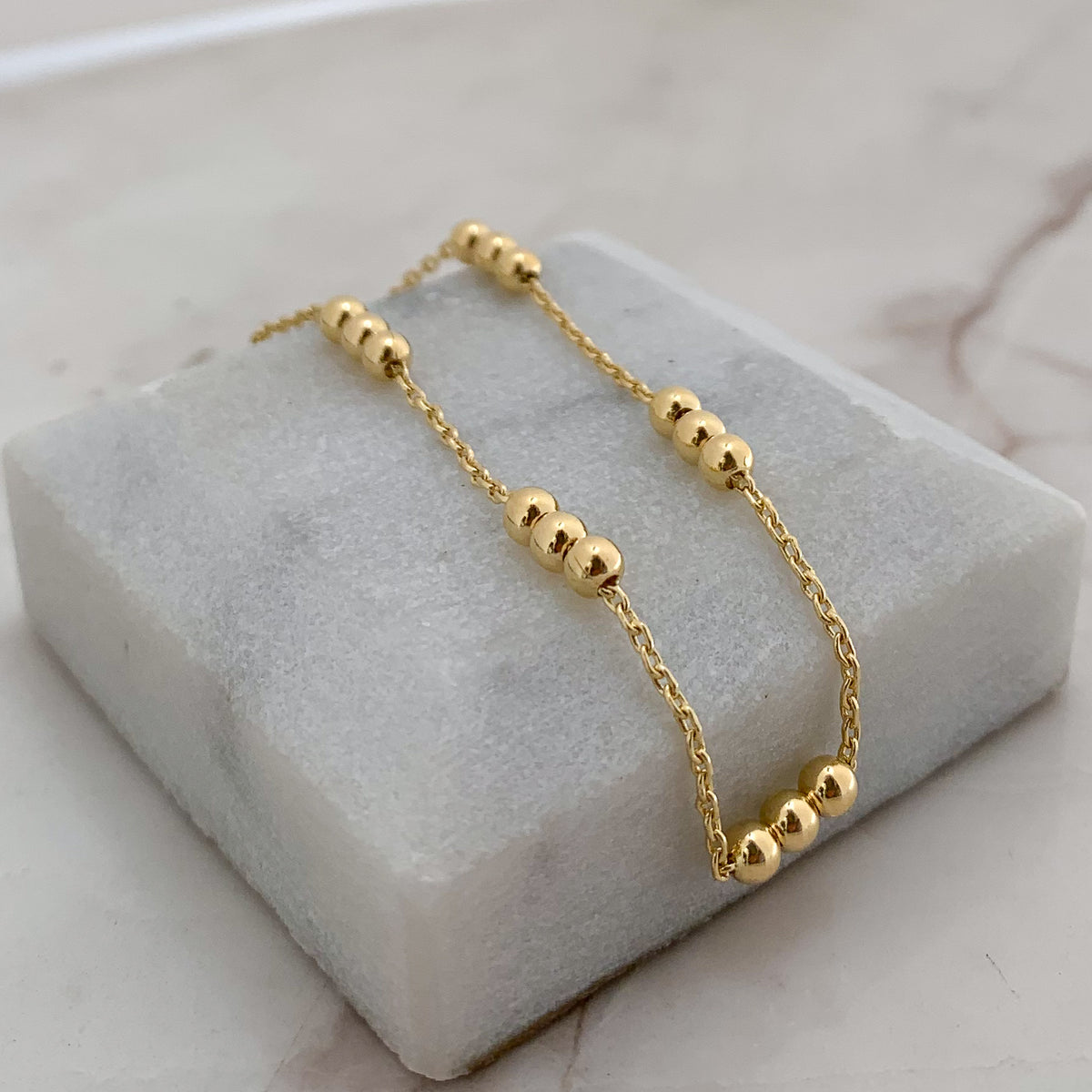 Pulsera Tres Bolitas en Oro 18K