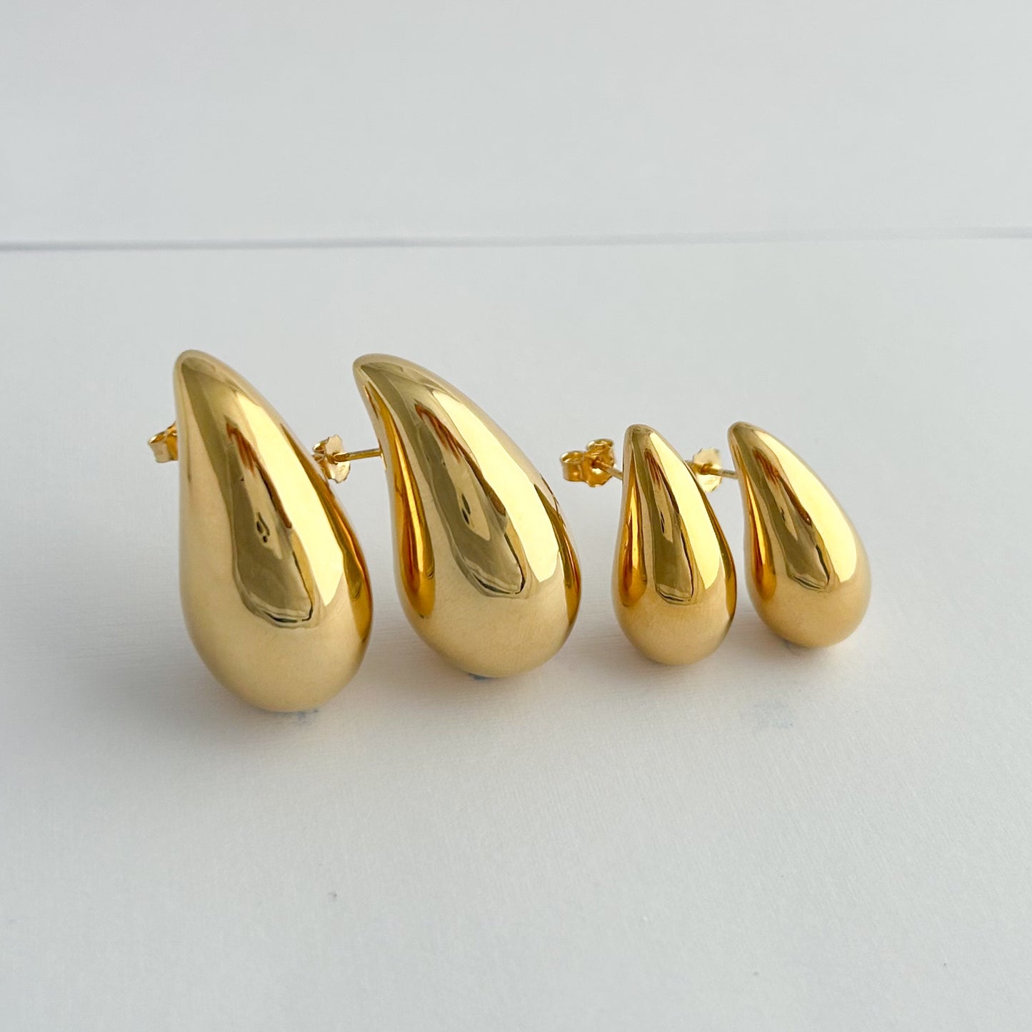 Aretes gota drop bombé oro 18k