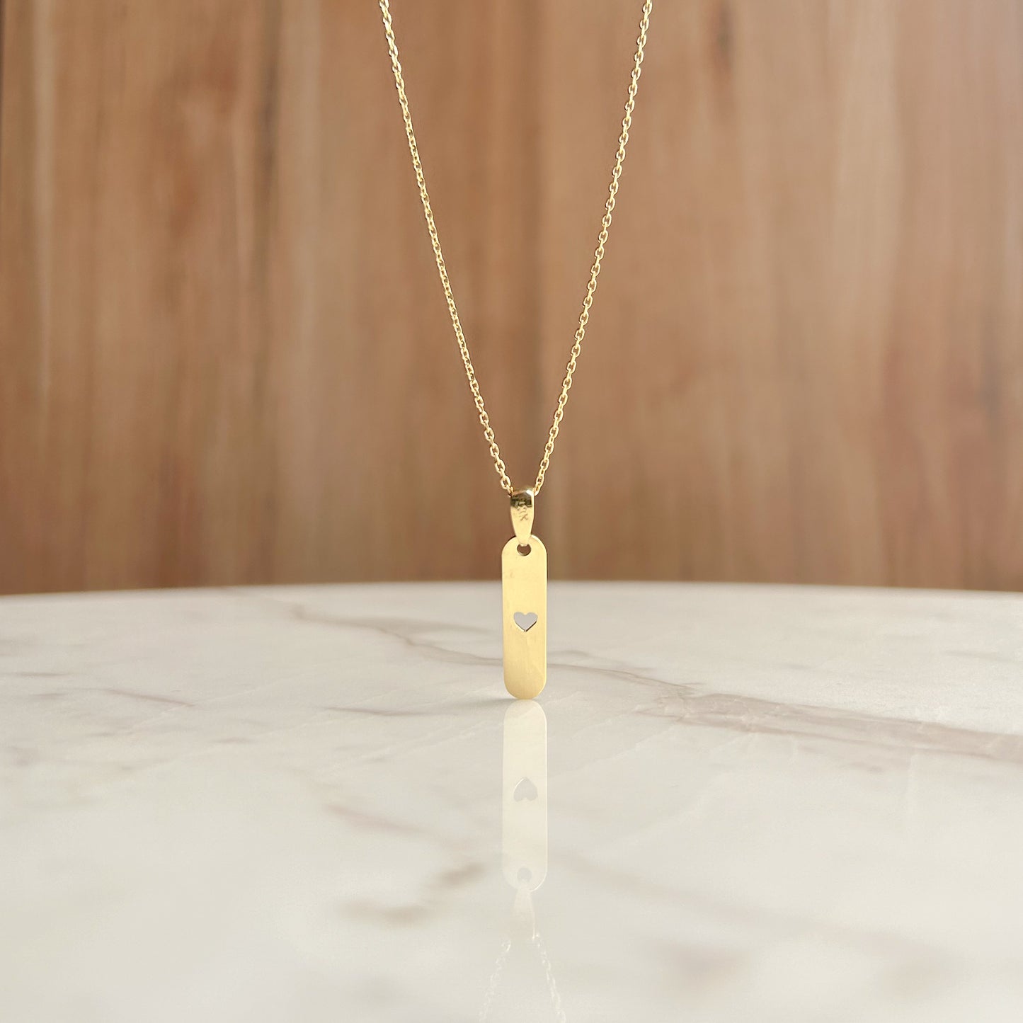 Dije de Placa con corazón calado oro 18k