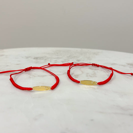 Pulsera hilo con plaquita oro 18k