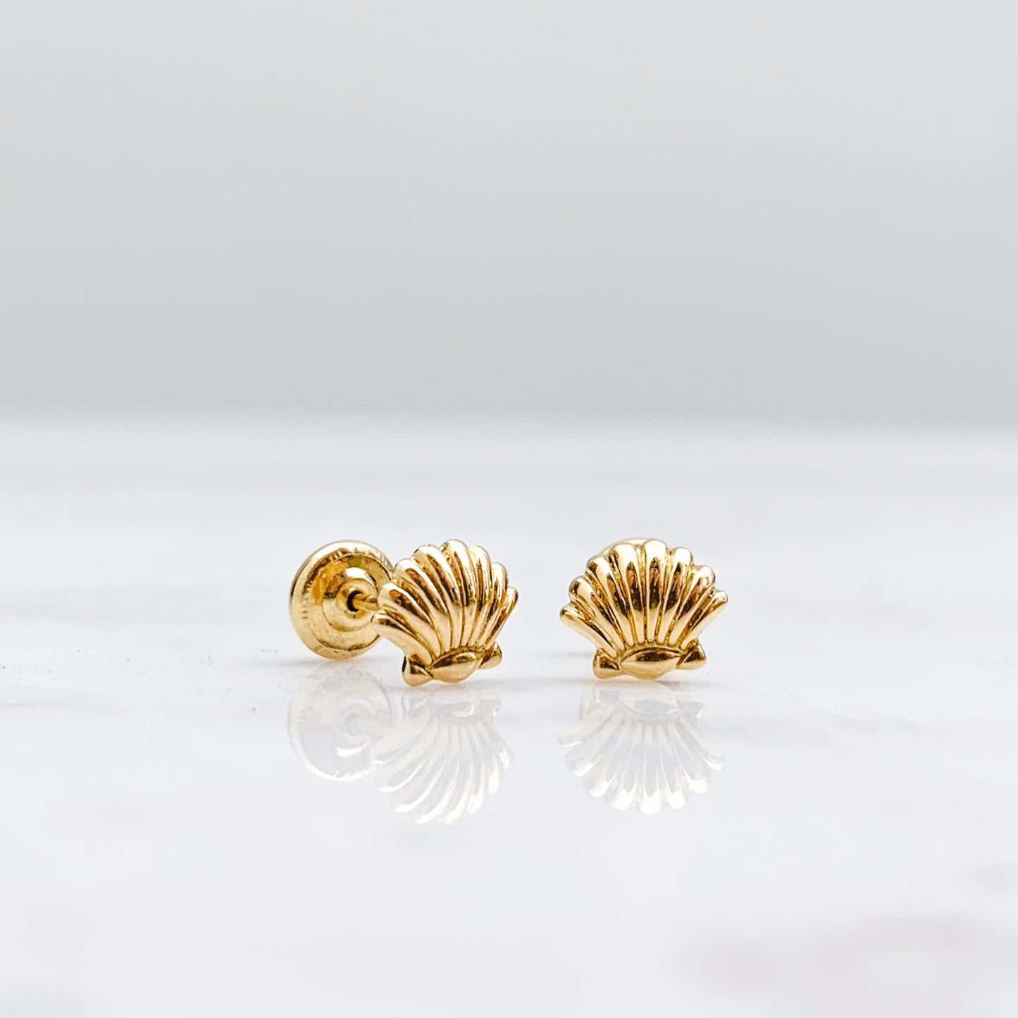 Aretes de bebé Oro18k conchita de mar