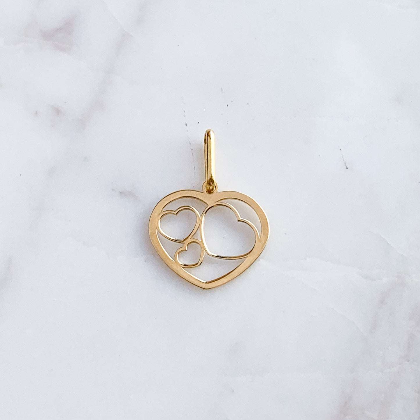 Dije corazones unidos de Oro18k