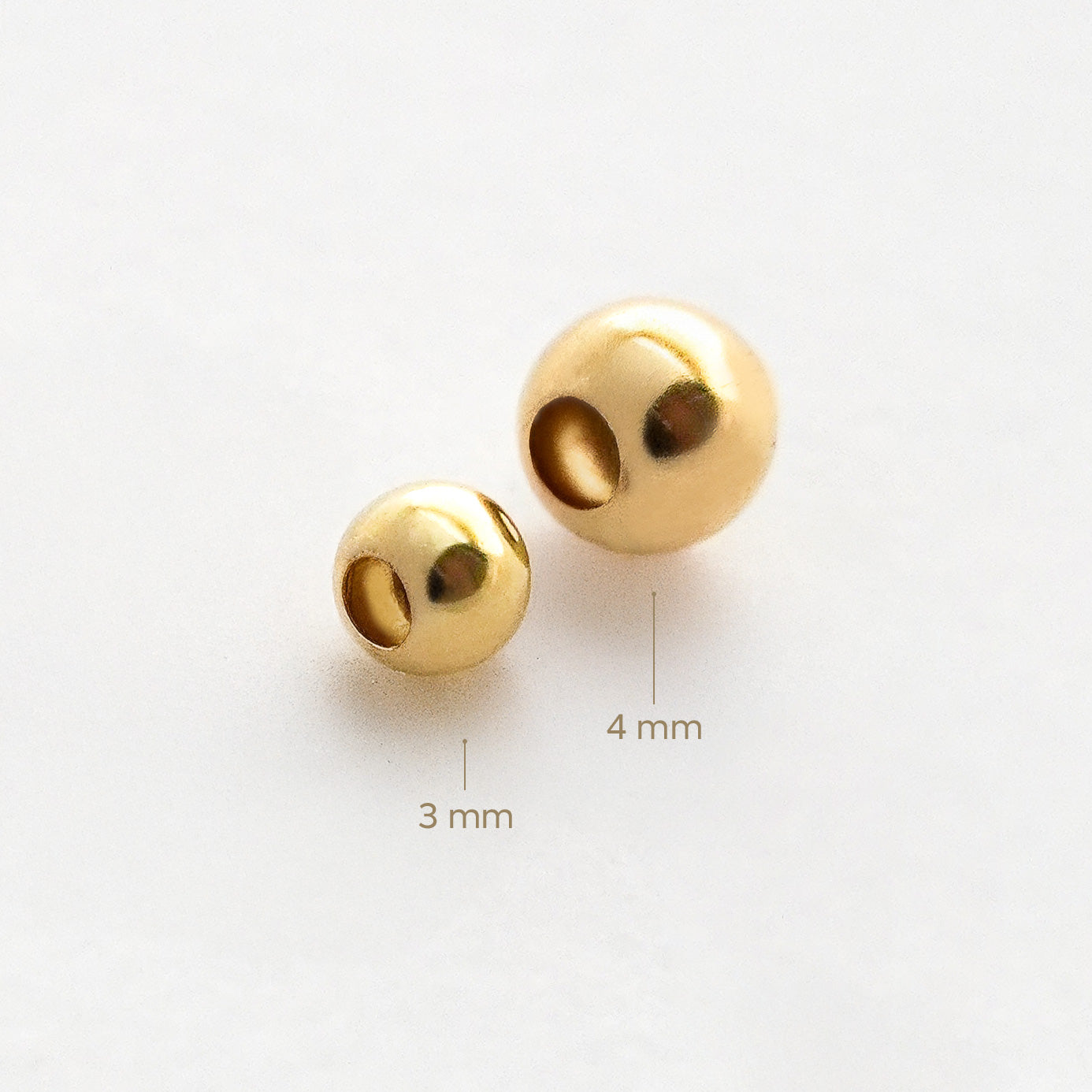 Bolita Pasante Lisa en Oro 18K