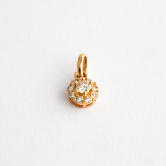 Dije roseta redonda punto de luz con diamantes en oro18k