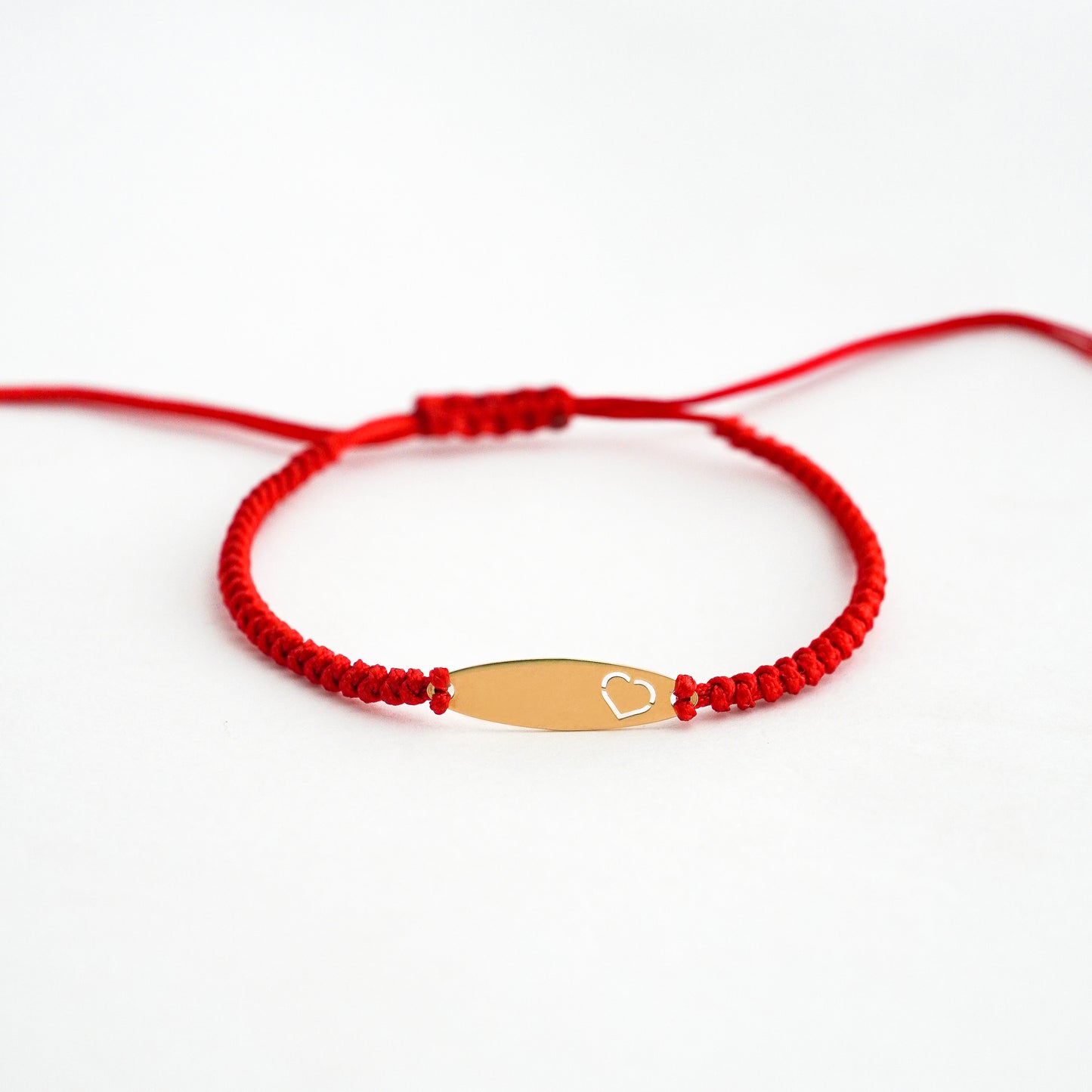 Pulsera tejida hilo con placa oval oro 18k