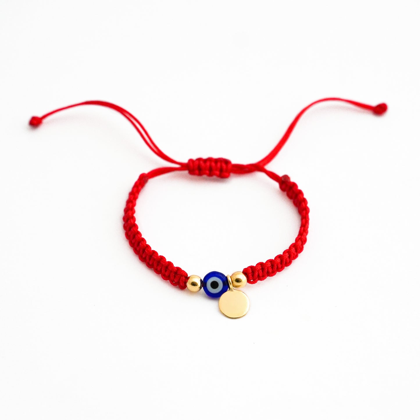 Pulsera tejida protectora con ojo turco y placa en Oro18k