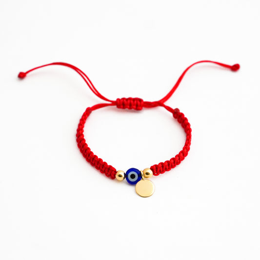 Pulsera tejida protectora con ojo turco y placa en Oro18k
