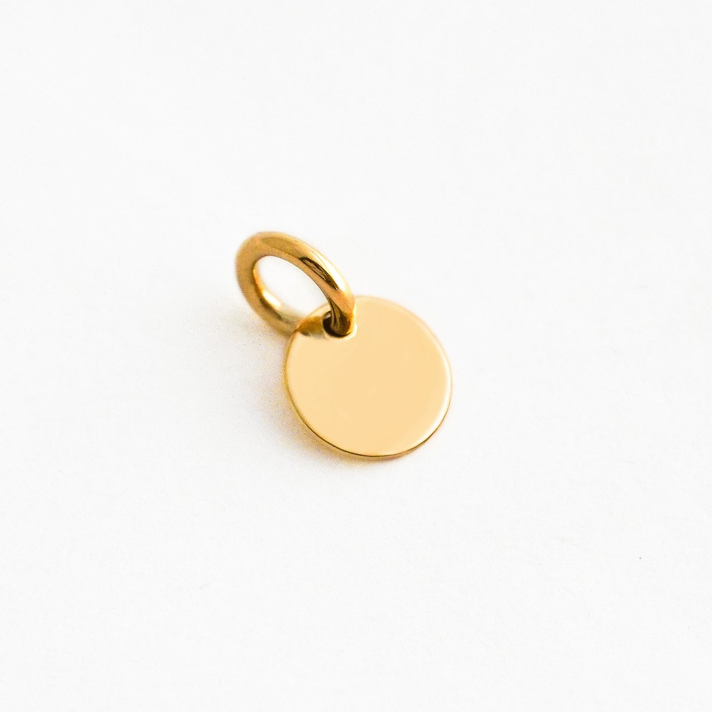 Dije Placa redonda Mini 7 mm  Oro 18K