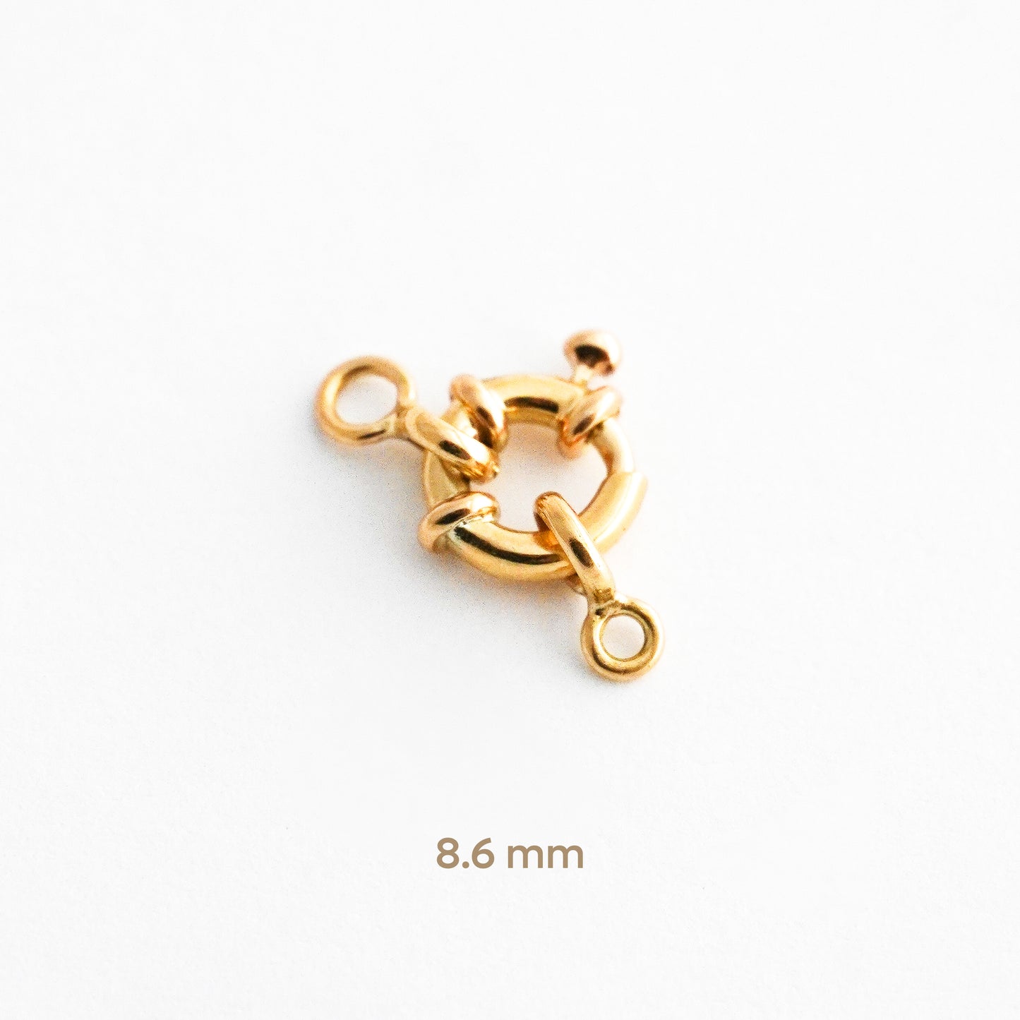 Broche mosquetón o timón en Oro 18K