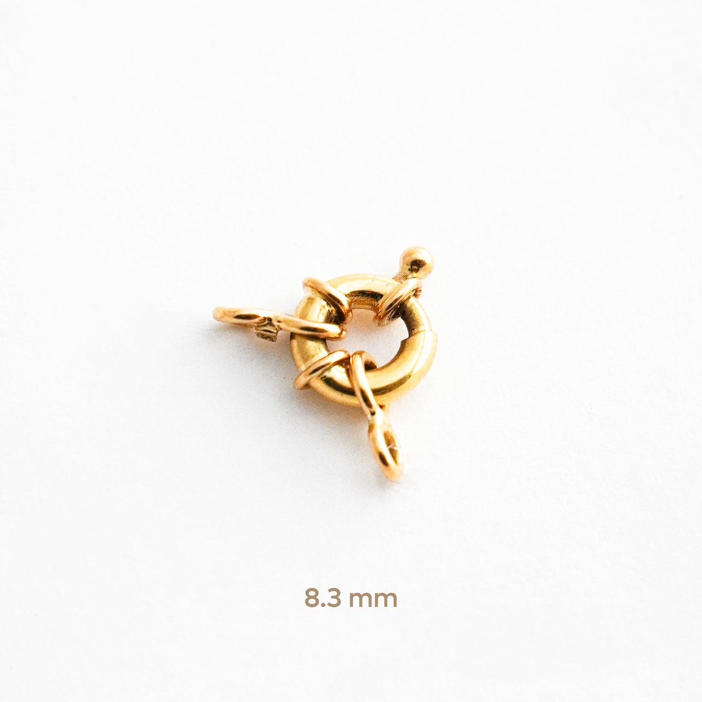 Broche mosquetón o timón en Oro 18K