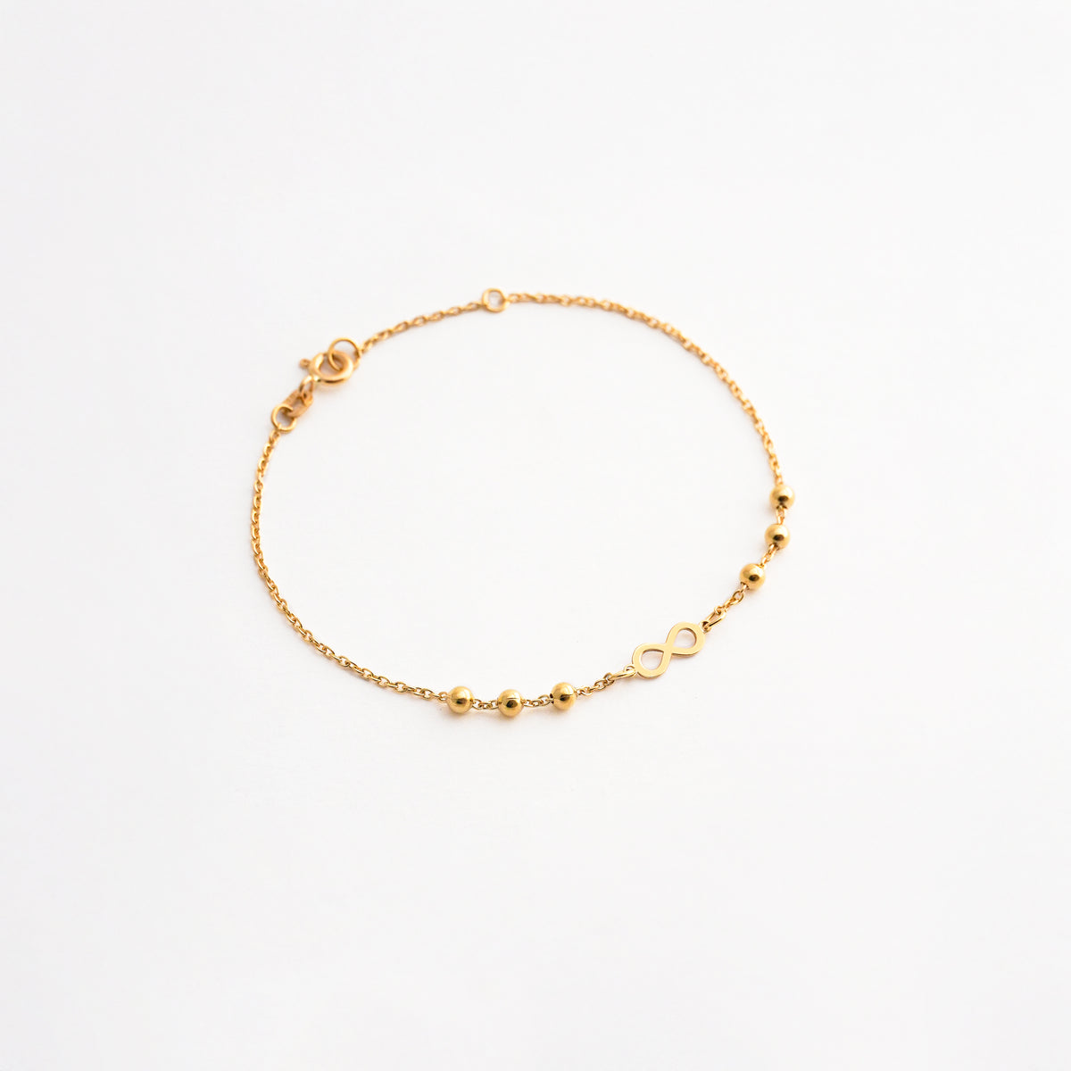 Pulsera Infinito con Bolitas en Oro 18K