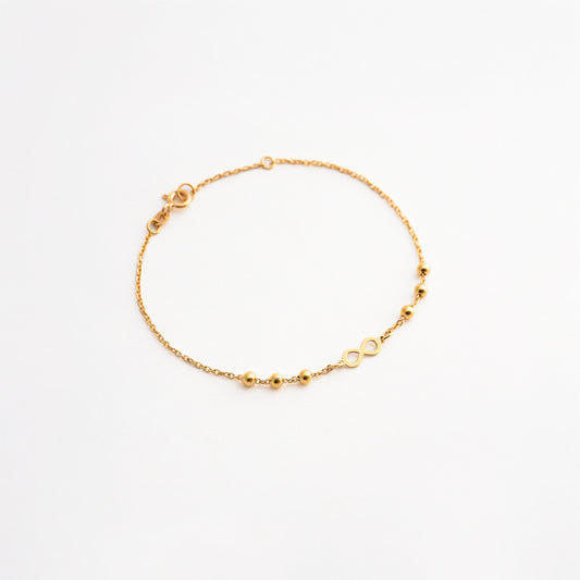 Pulsera Infinito con Bolitas en Oro 18K