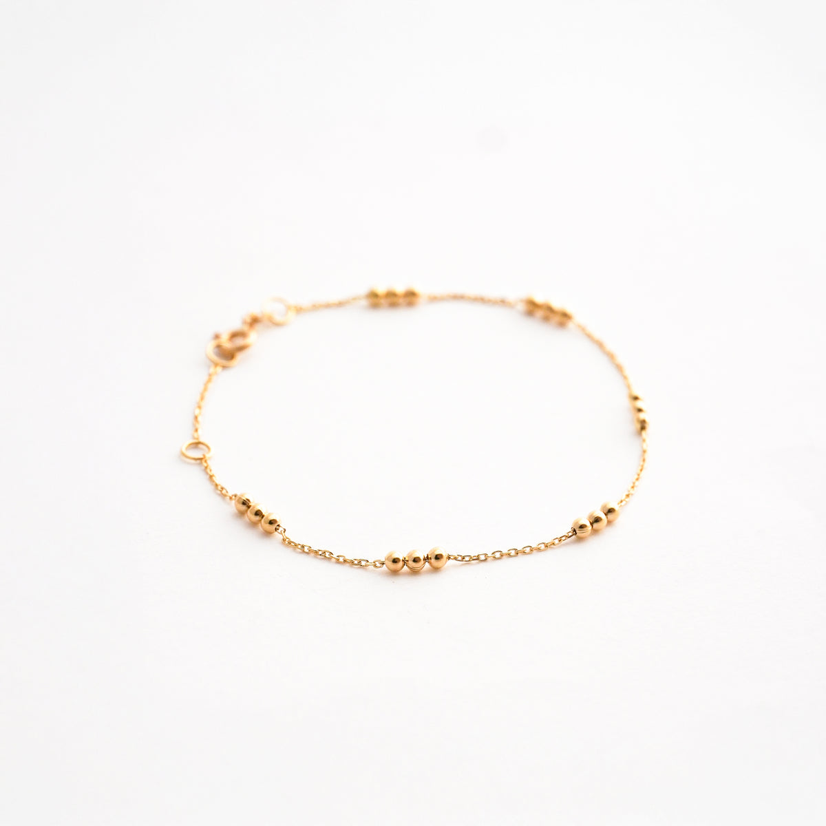 Pulsera Tres Bolitas en Oro 18K