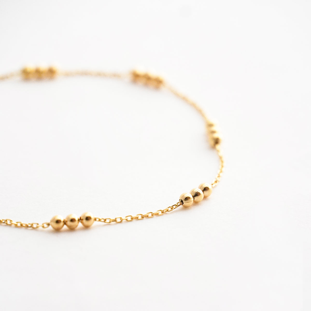 Pulsera Tres Bolitas en Oro 18K