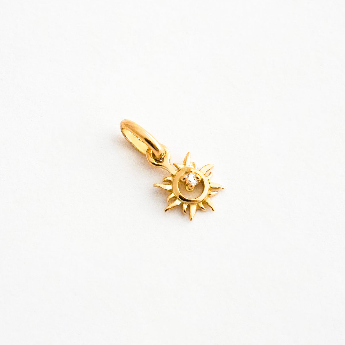 Dije Sol Natal en Oro 18K