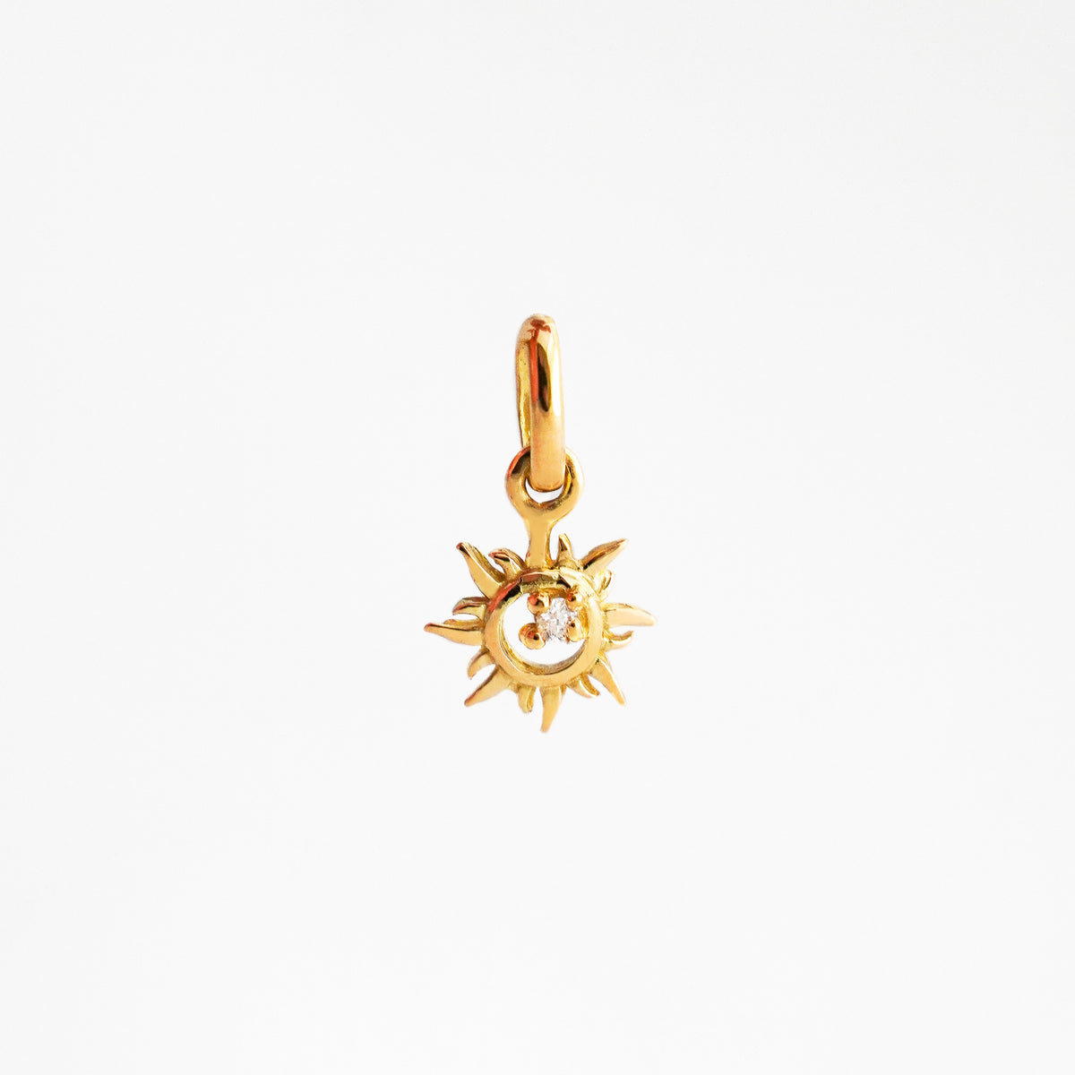 Dije Sol Natal en Oro 18K