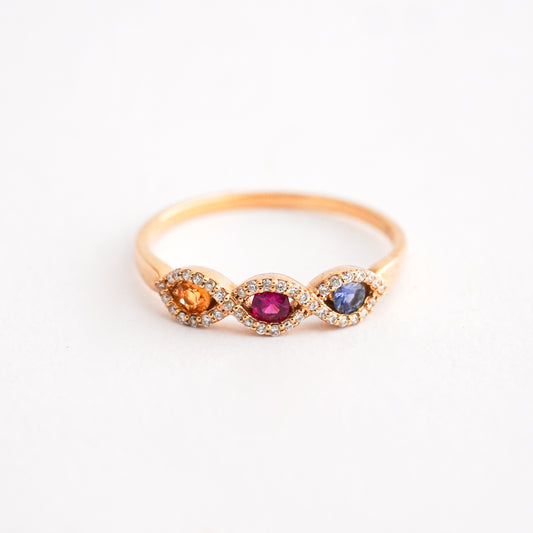 Anillo Divine Eyes con Rubí, Zafiros y diamantes en Oro 18K