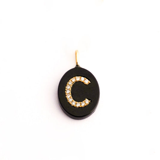 Dije de letra con diamantes naturales y ónix natural Oro18k