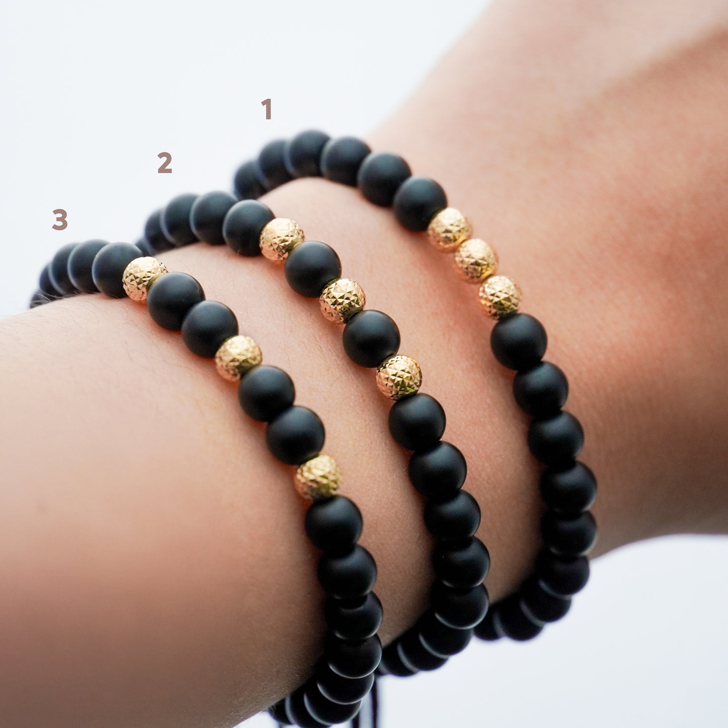 Pulsera tejida ónix con bolitas diamantadas 5mm en Oro18k