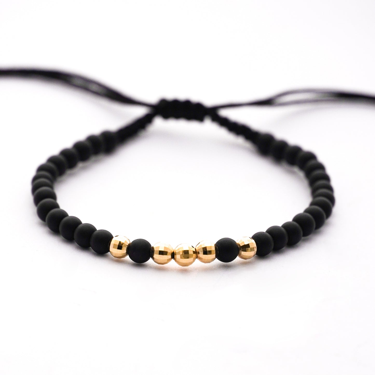 Pulsera tejida ónix con bolitas diamantadas 4 mm en Oro18k