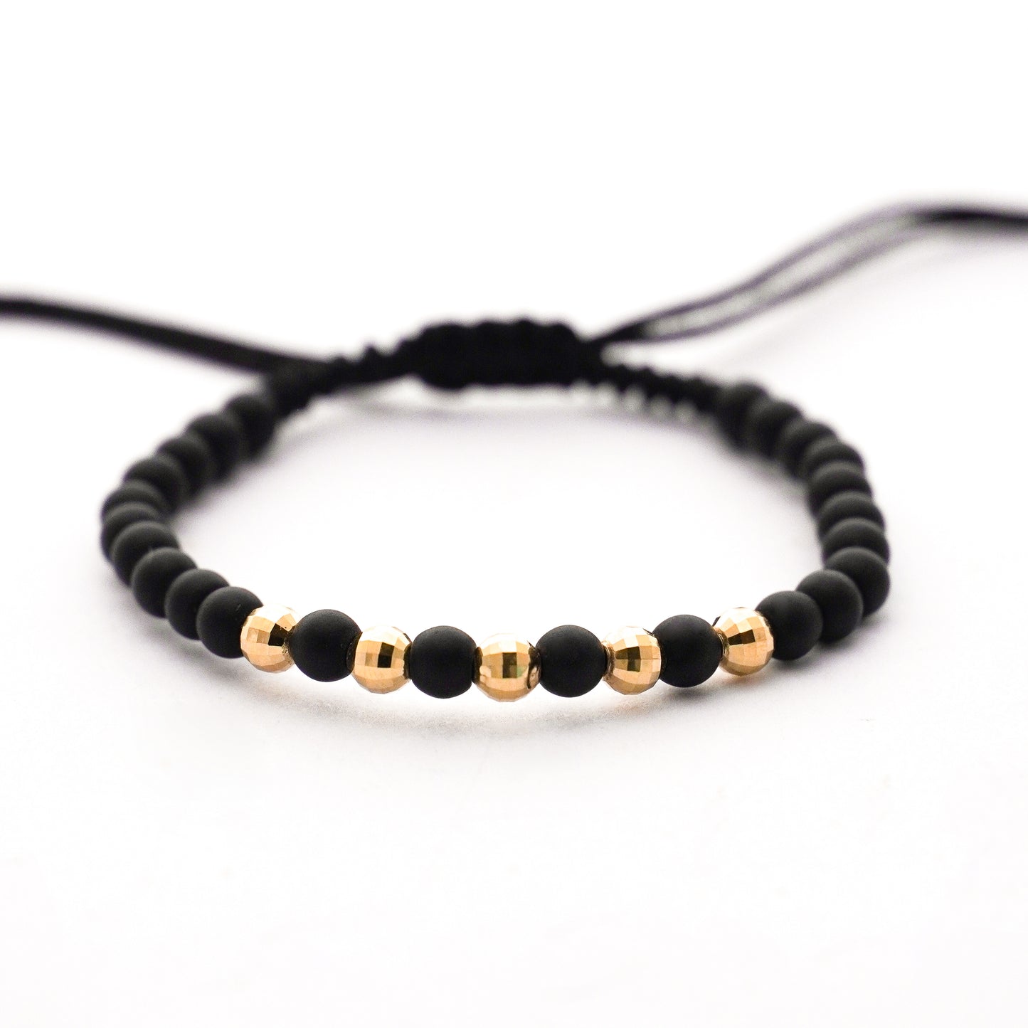 Pulsera tejida ónix con bolitas diamantadas 4 mm en Oro18k