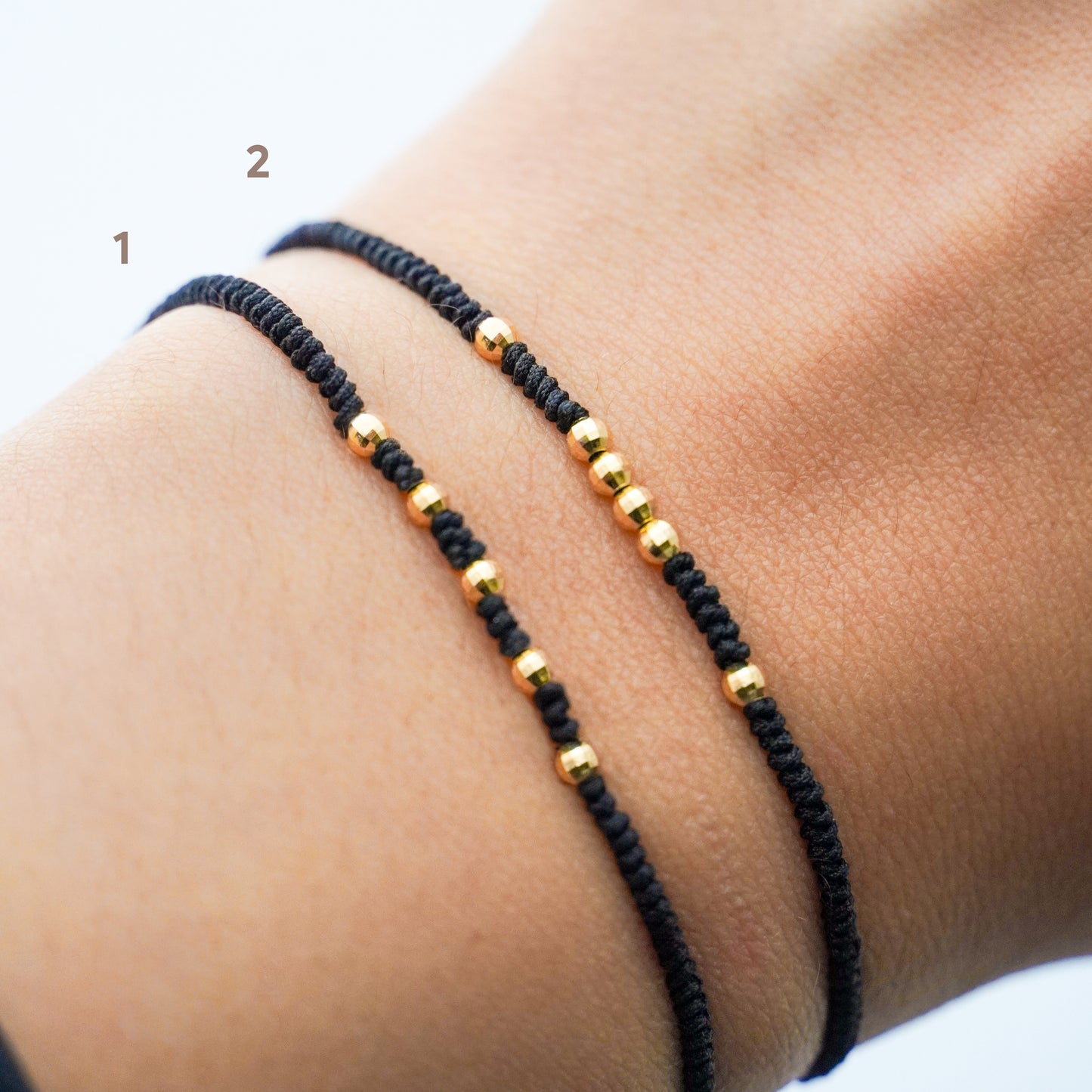 Pulsera tejida black line con bolitas diamantadas 2.5 mm en Oro18k